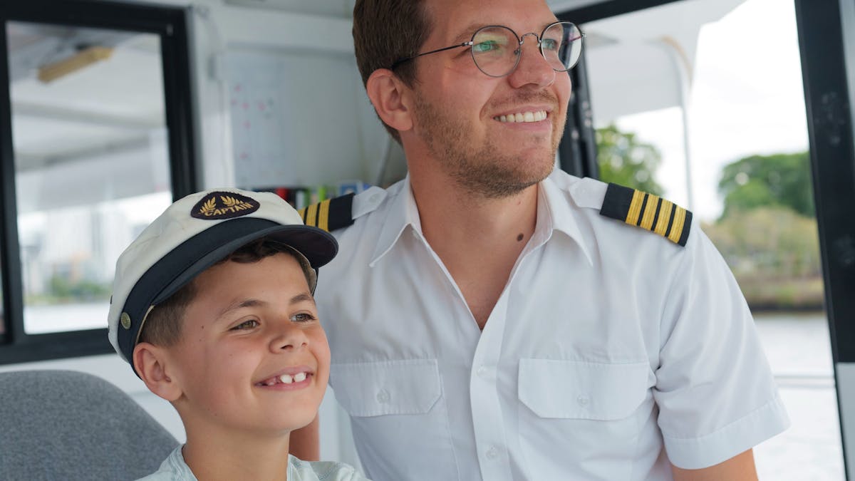 A boy getting to drive Mirimar II under Captain supervision