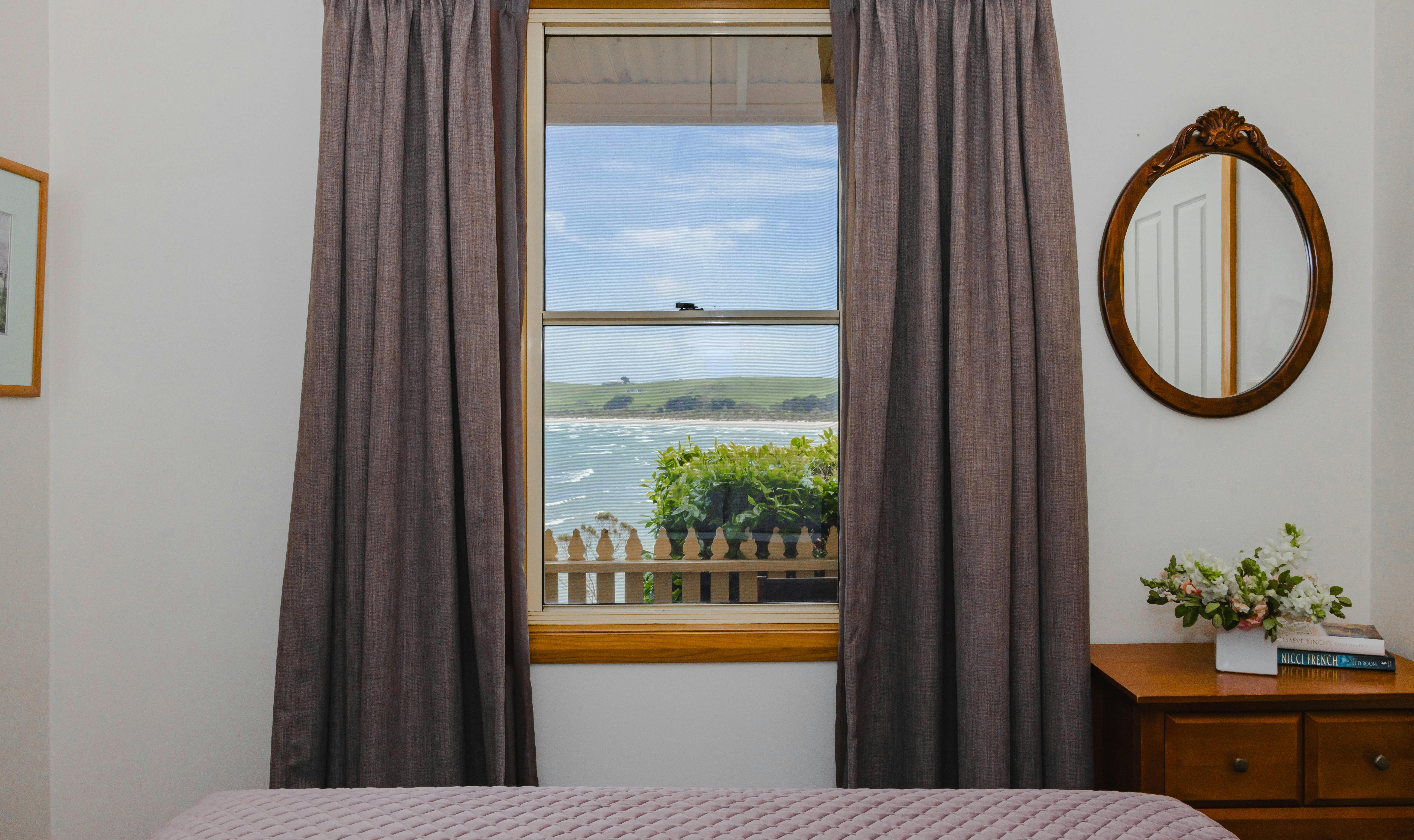 queen bedroom with views to the sea
