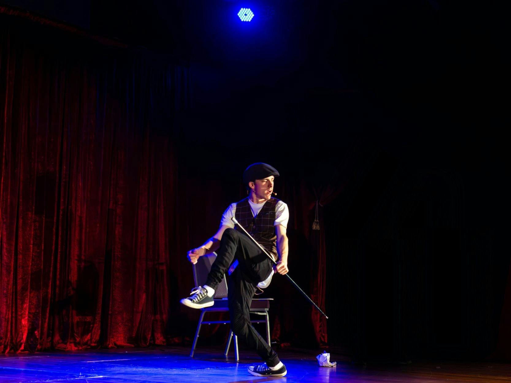 Magician on stage doing a trick