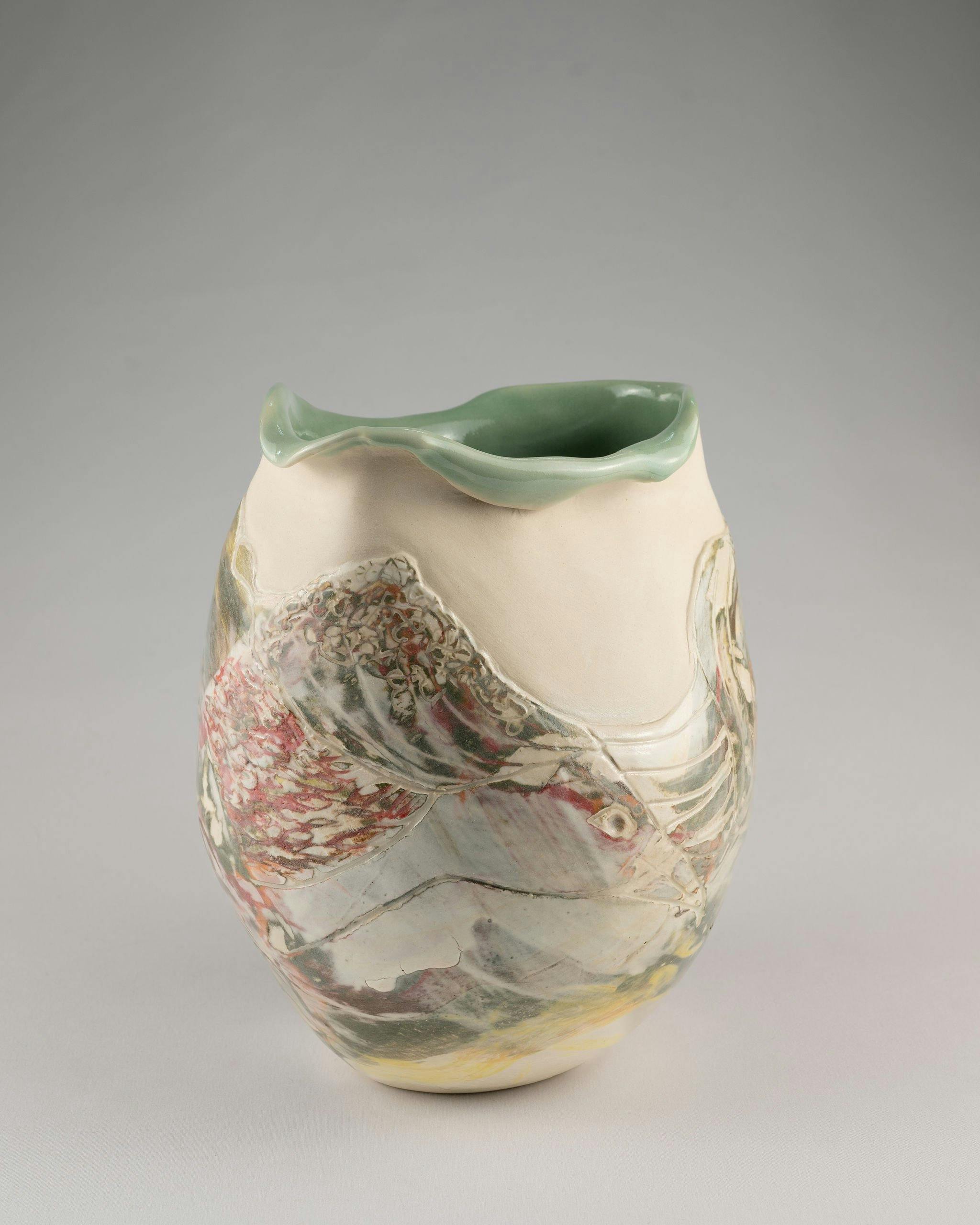 Wheel thrown and altered stoneware, carved and hand painted