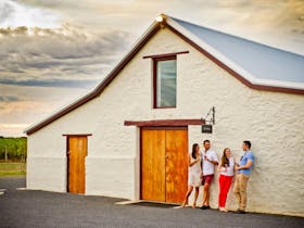 Adults enjoying glass of wine outside Katnook Estate Stables