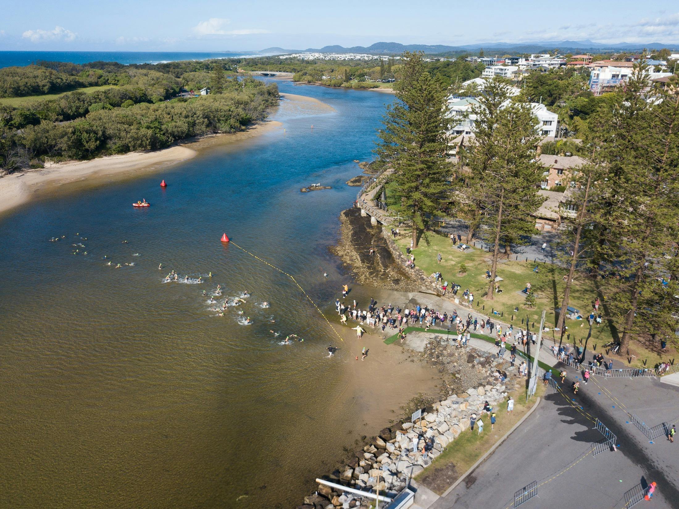 Swimmers exiting the water in Cudgen Creek