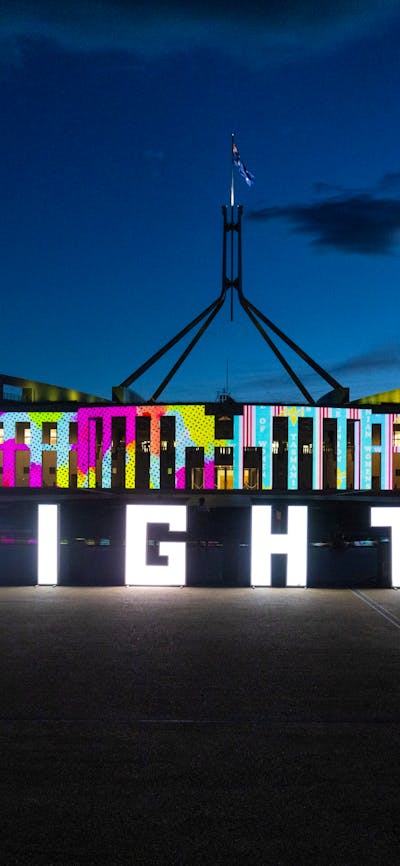 Enlighten letters displayed in front of Parliament House