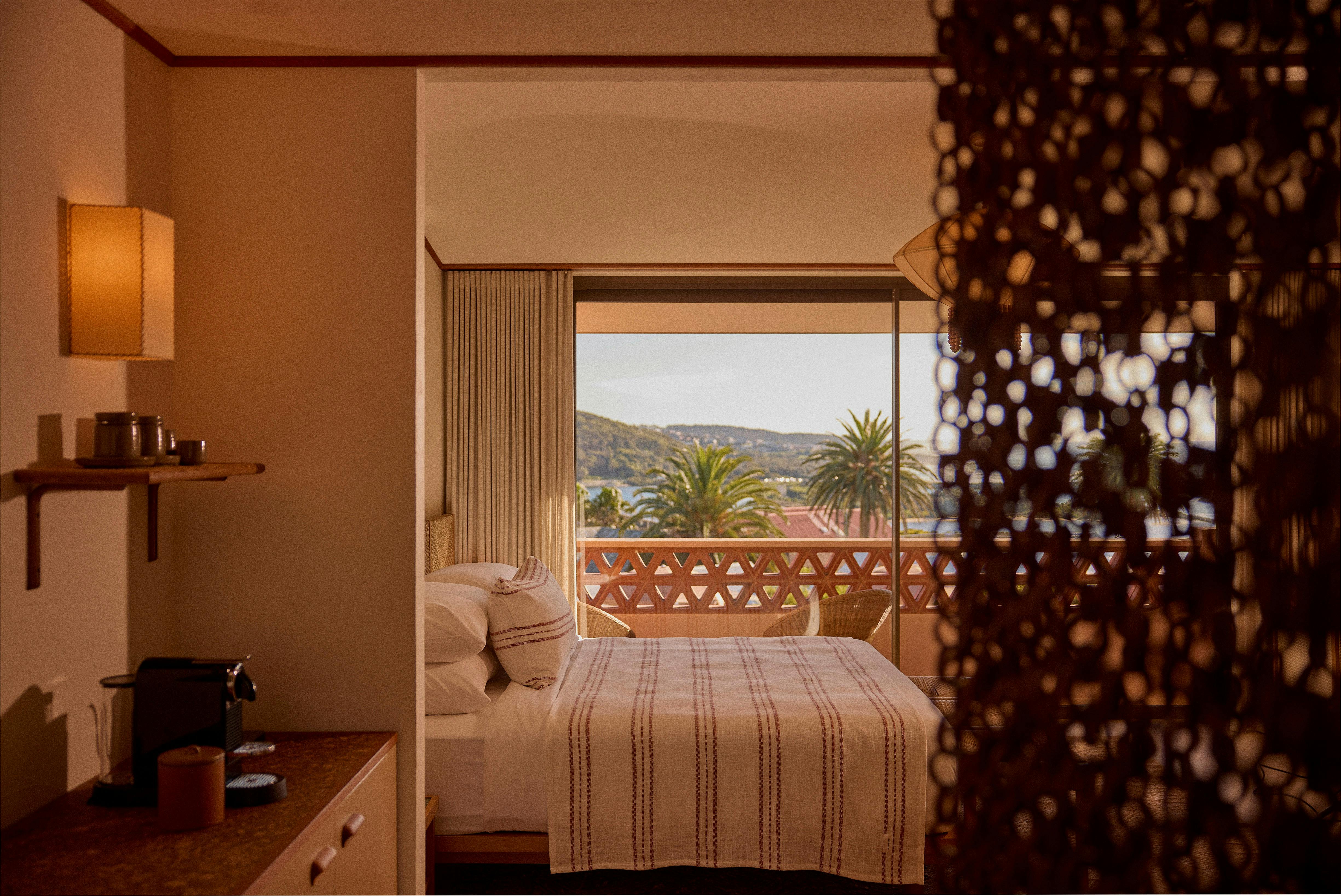 Room with bed looking out of the inlet at Narooma