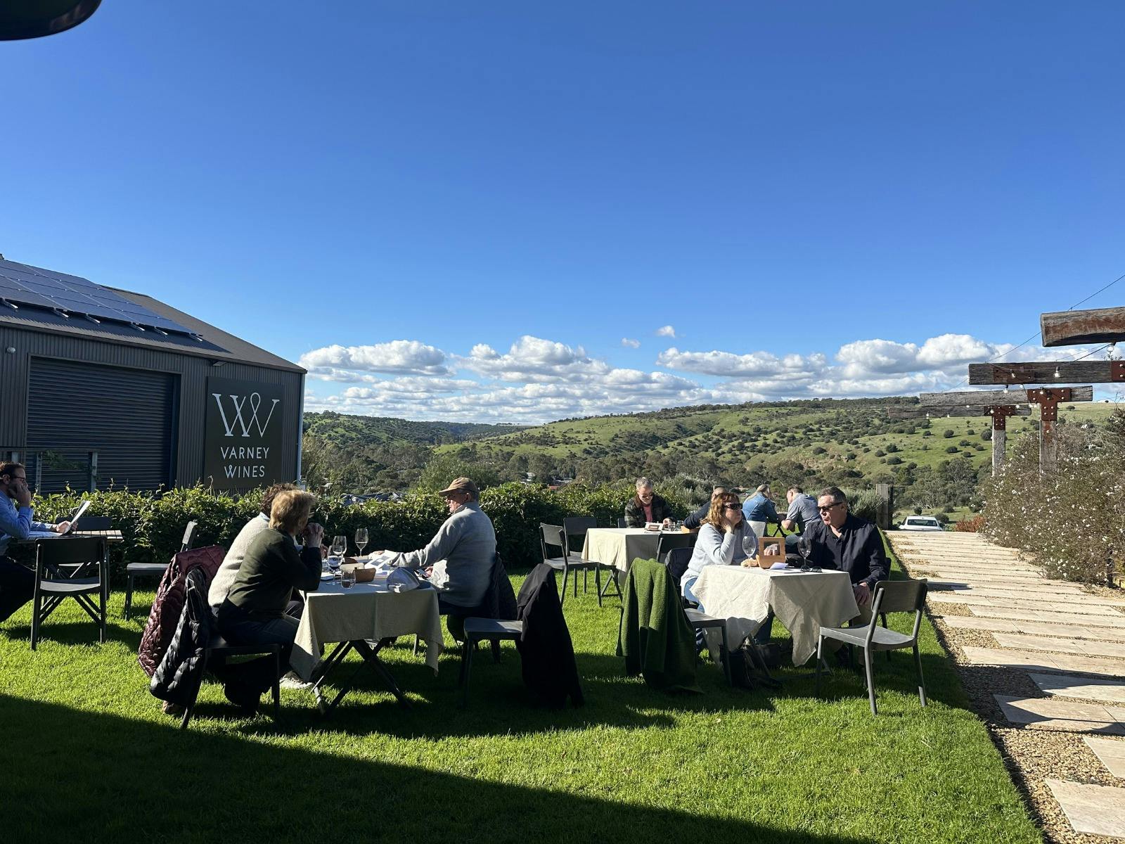 Guests at lawn tables outside at Varney Wines