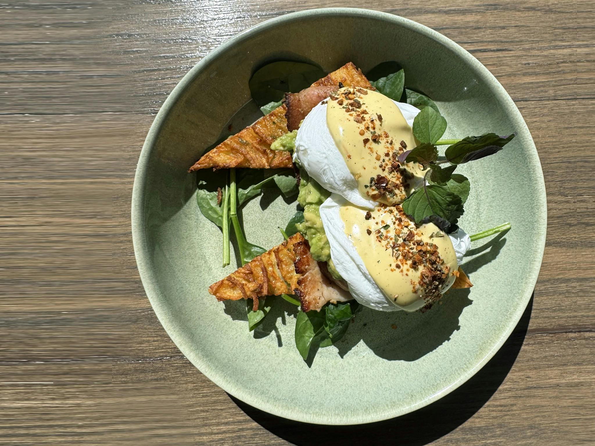 Native Harvest Hash Stack topped with macadamia hollandaise Eggs Benny