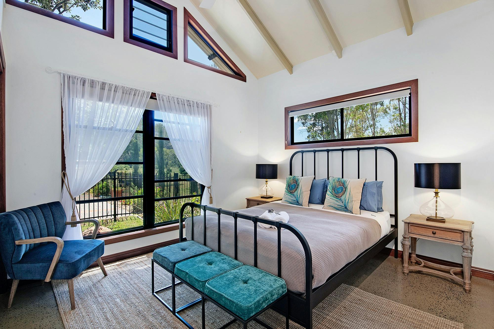 The Peacock Room with Queen bed overlooks the 25 metre swimming pool