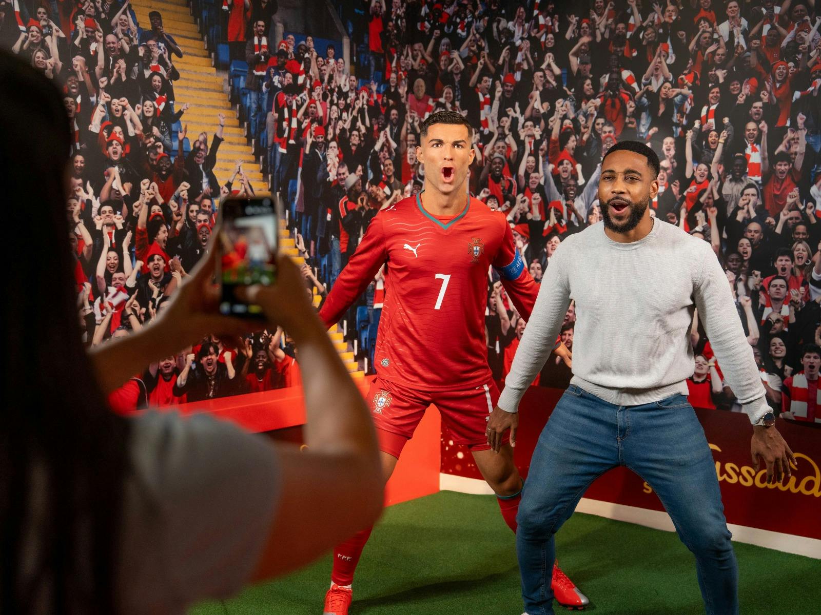 Fan posing with the iconic athlete, Christiano Ronaldo, at Madame Tussauds Sydney