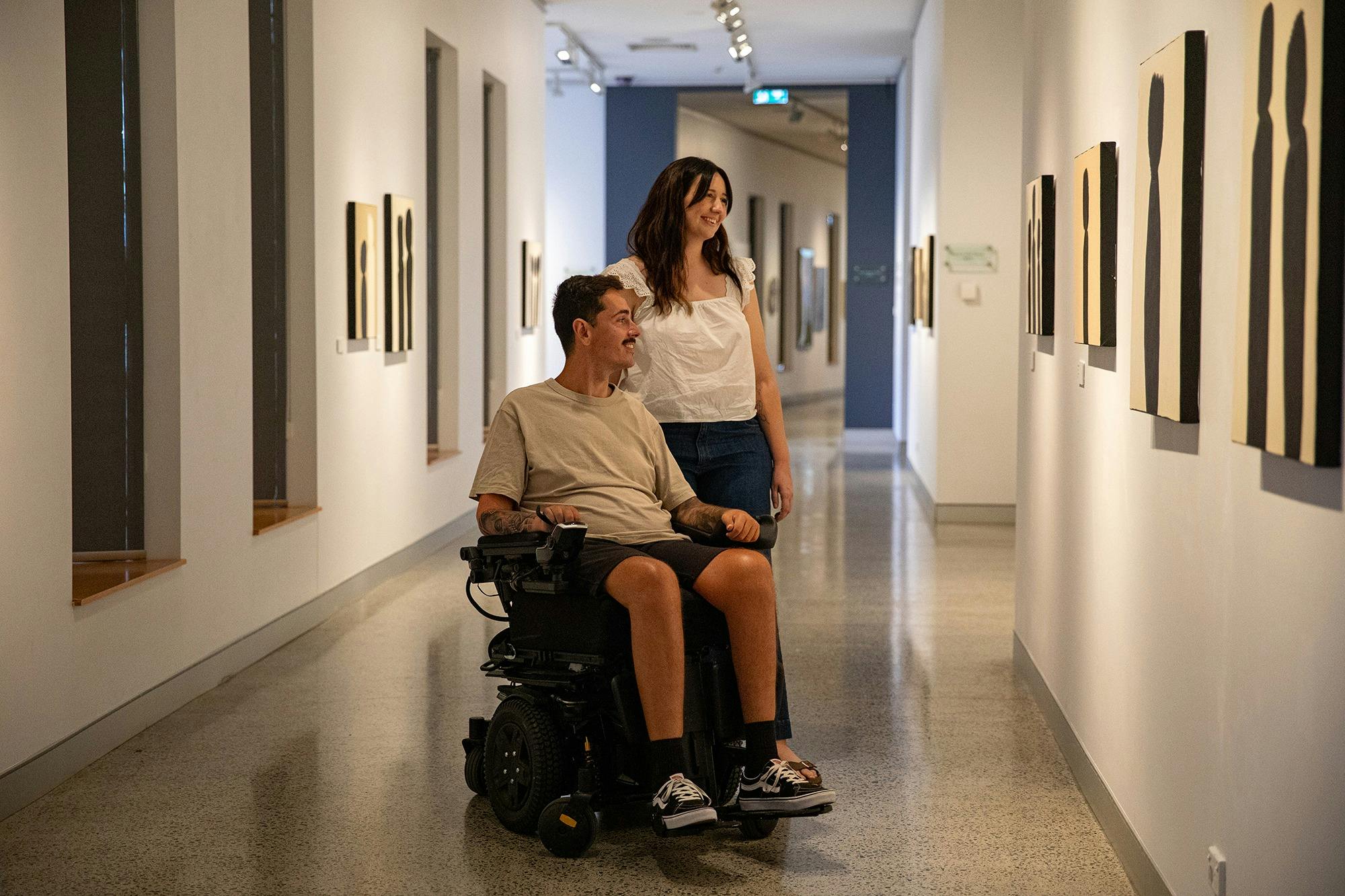 Visitors viewing exhibition by Murwillumbah artist Michael Philp