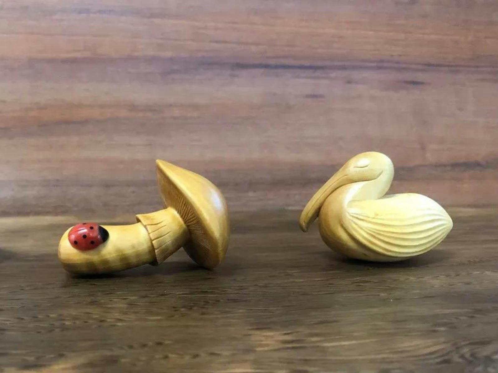 Hand carved small wooden bird and mushroom