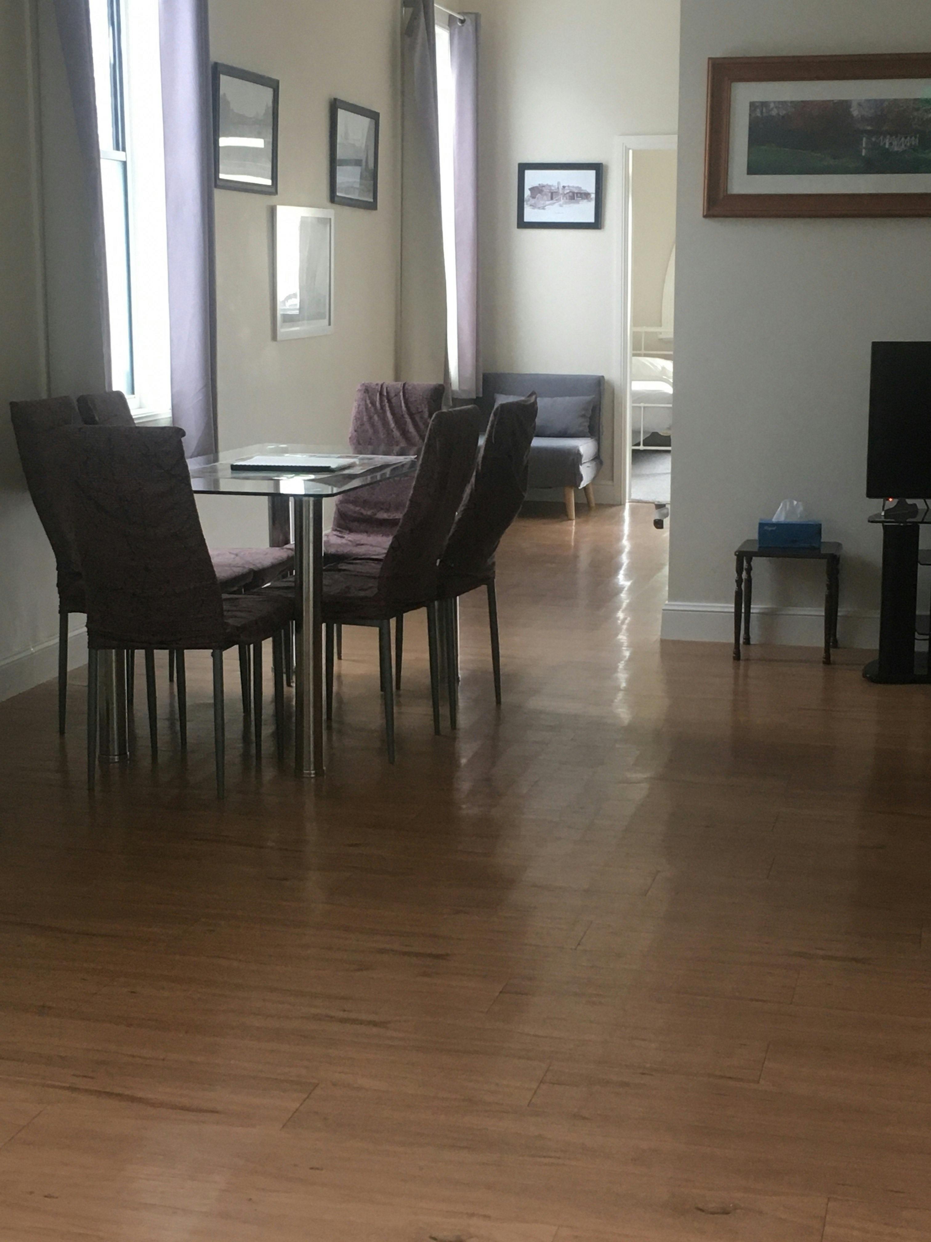 Dining tables & chairs looking into Main bedroom