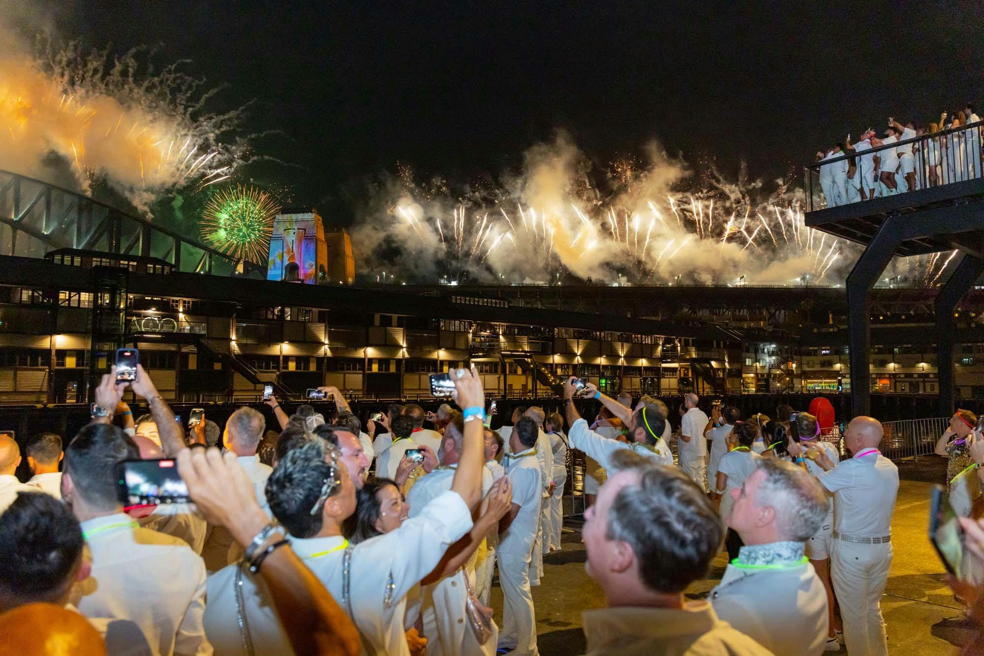Crowd watching fireworks over Sydney Harbour from Walsh Bay.