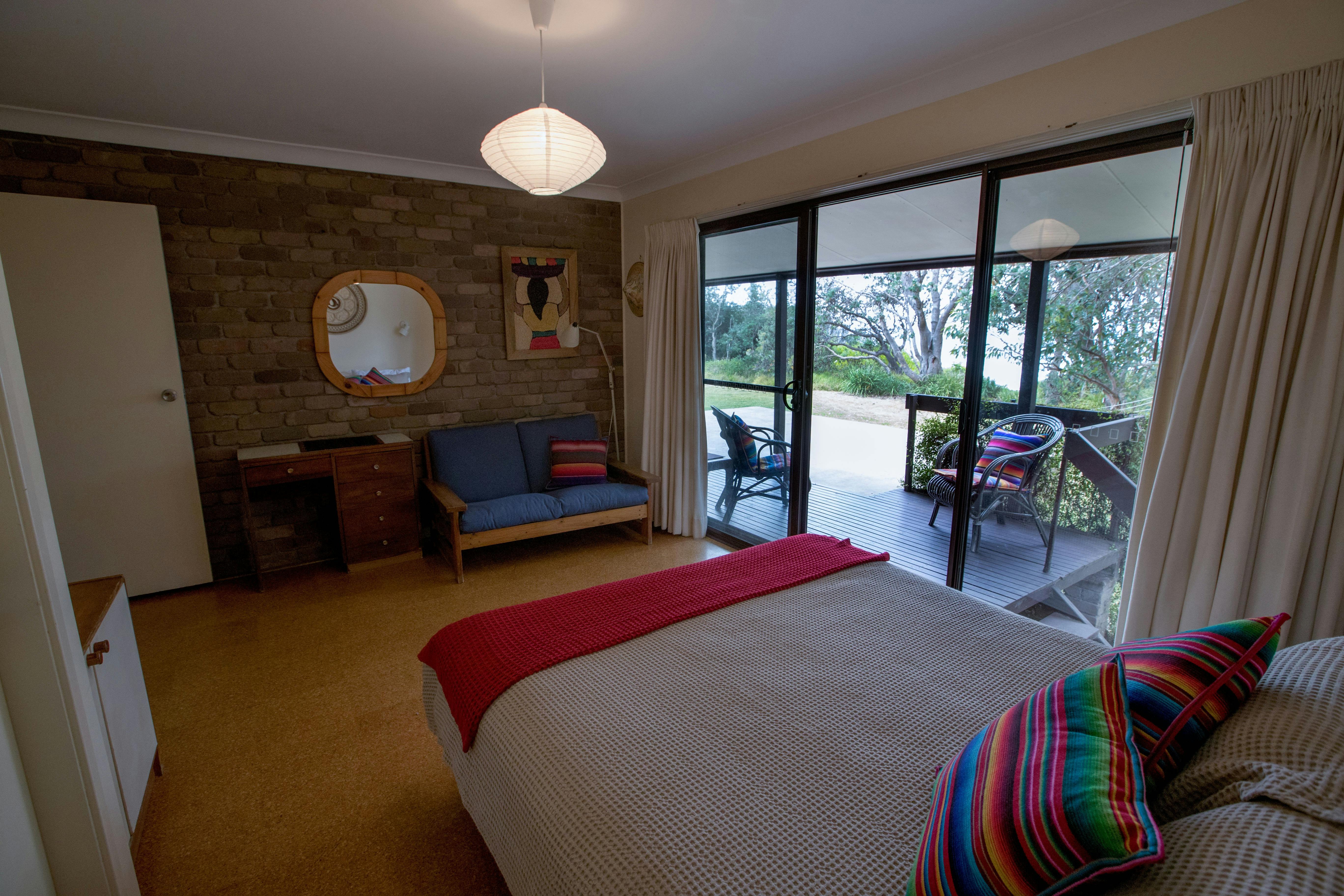 Listen to and smell the ocean from the luxurious main bedroom