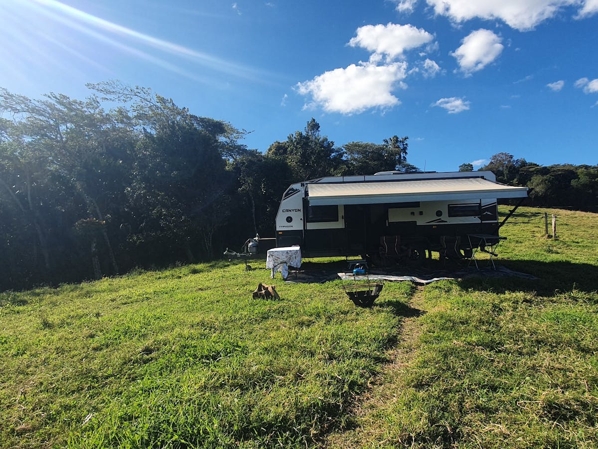 Honeyeater Haven at Crediton via Eungella Qld camp chairs under awning  and fire pit with a view