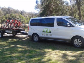 Vehicle towing trailer of bicycles.