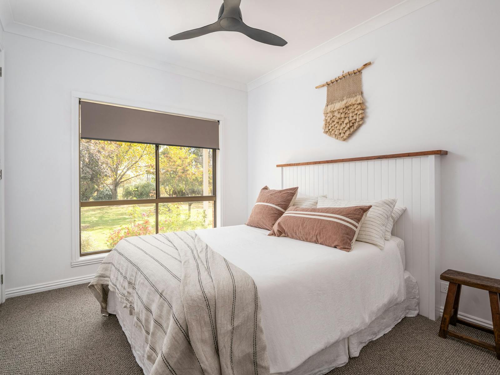 Bedroom with ceiling fan and garden view