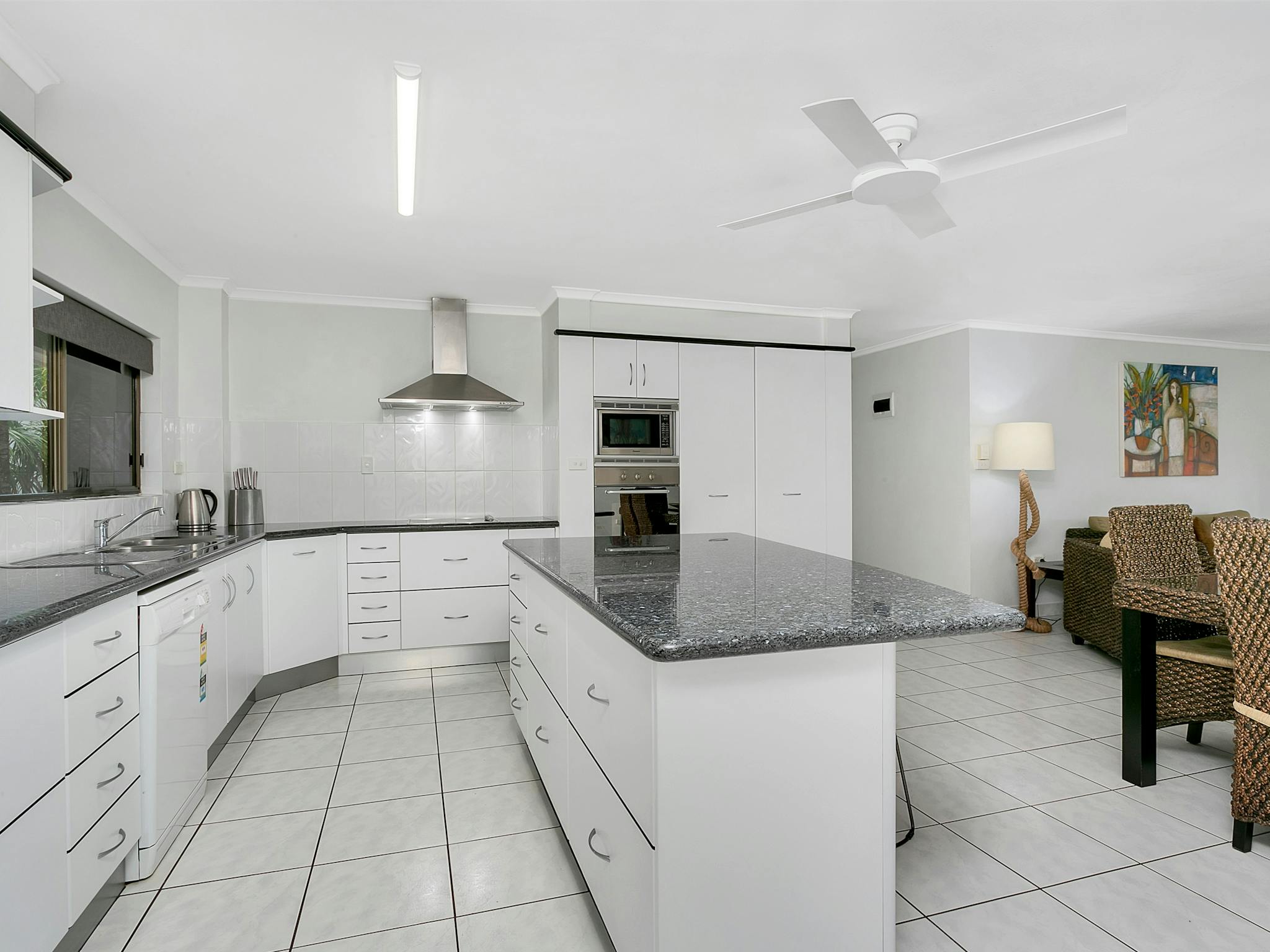 Full size kitchen, separate dining area with modern furnishings. elf contained Full size kitchen, separate dining area with modern furnishings. elf contained
