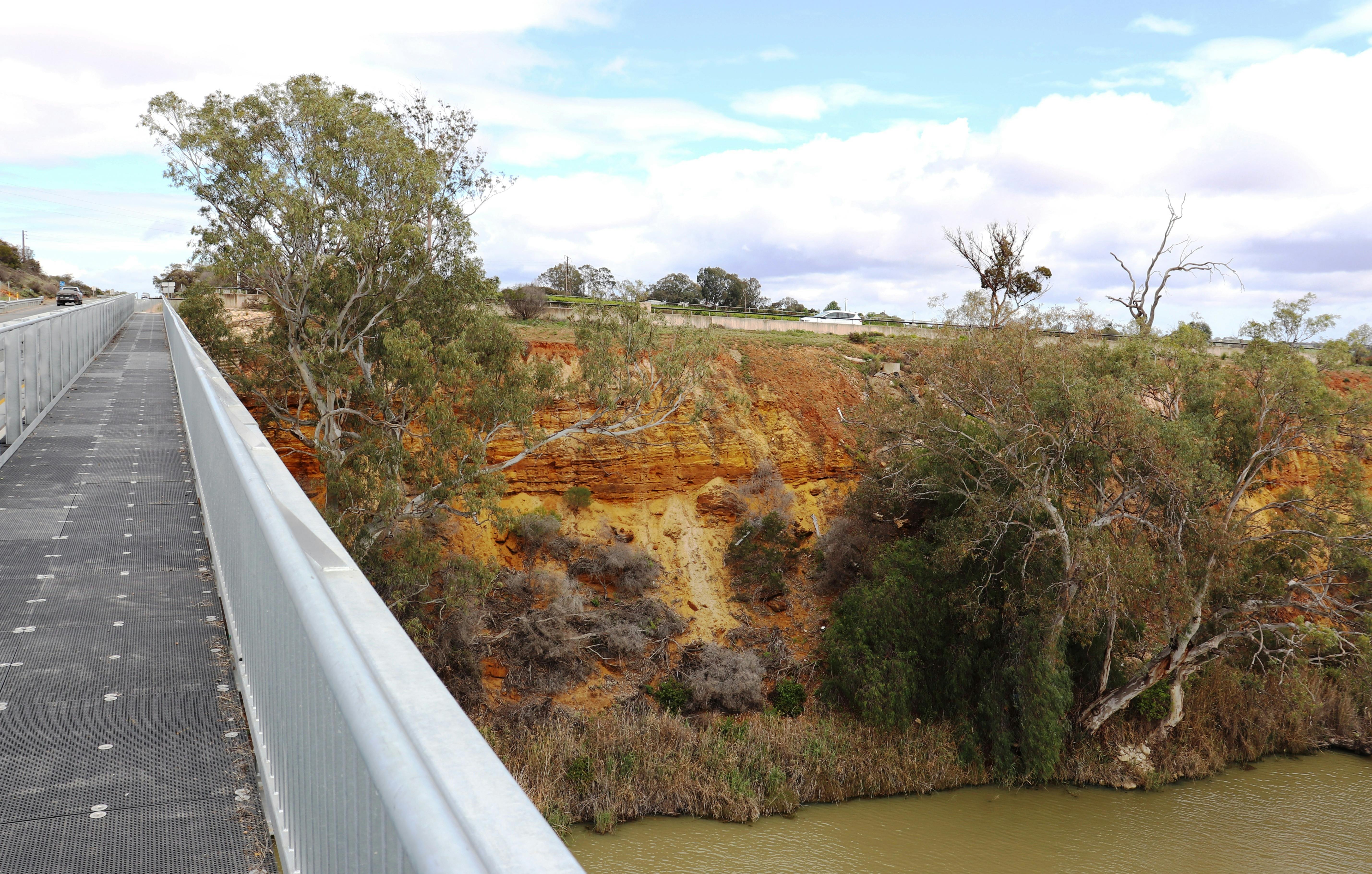 Pedestrians are able walk along a footpath on the bridge.