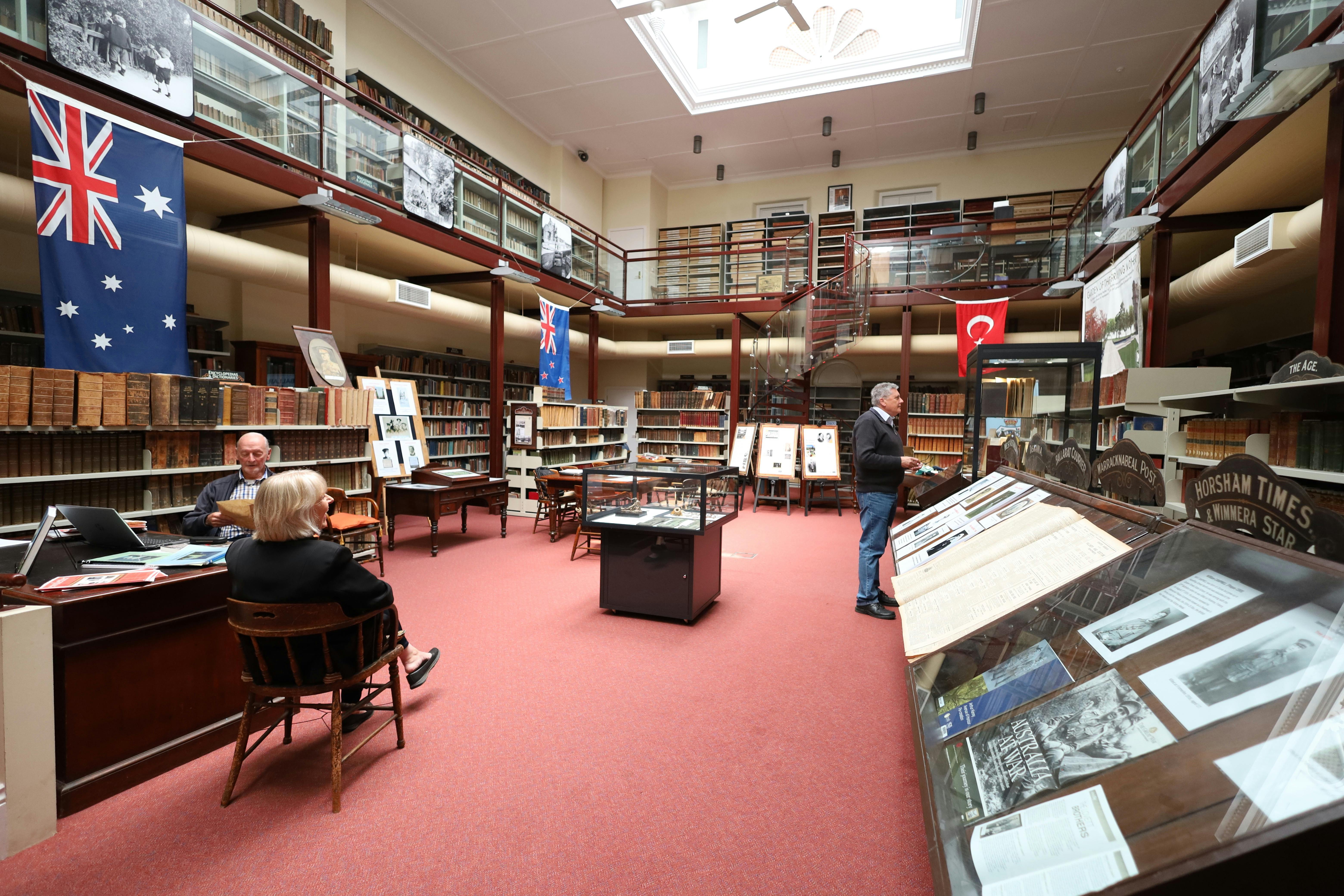 Photo of large room with books around the wall and a sunroof