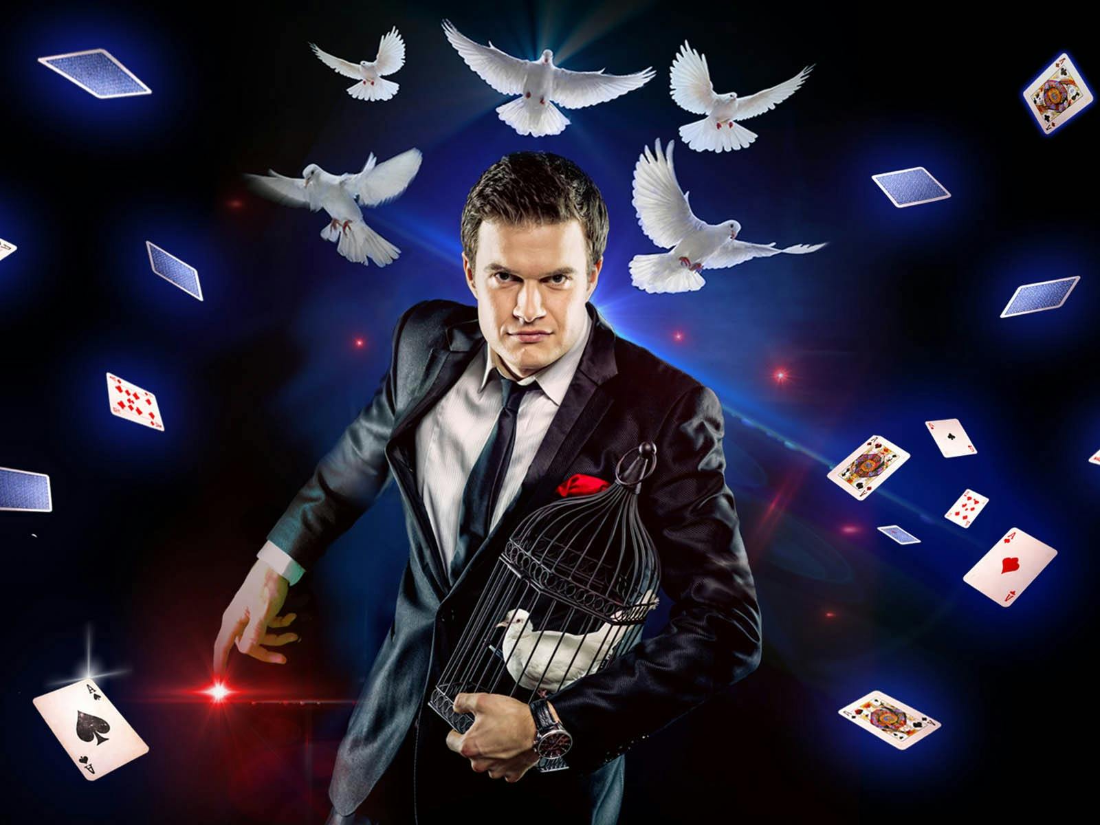 Magician holding birdcage as doves and playing cards float around Magician holding birdcage as doves and playing cards float around
