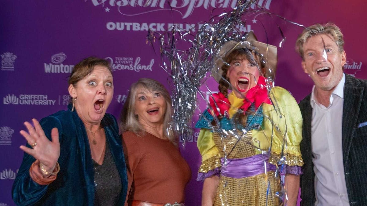 Victoria Baldock, Delvene Delaney, S.T.Ruth & David Wenham stand infront of Vision Splendid wall.