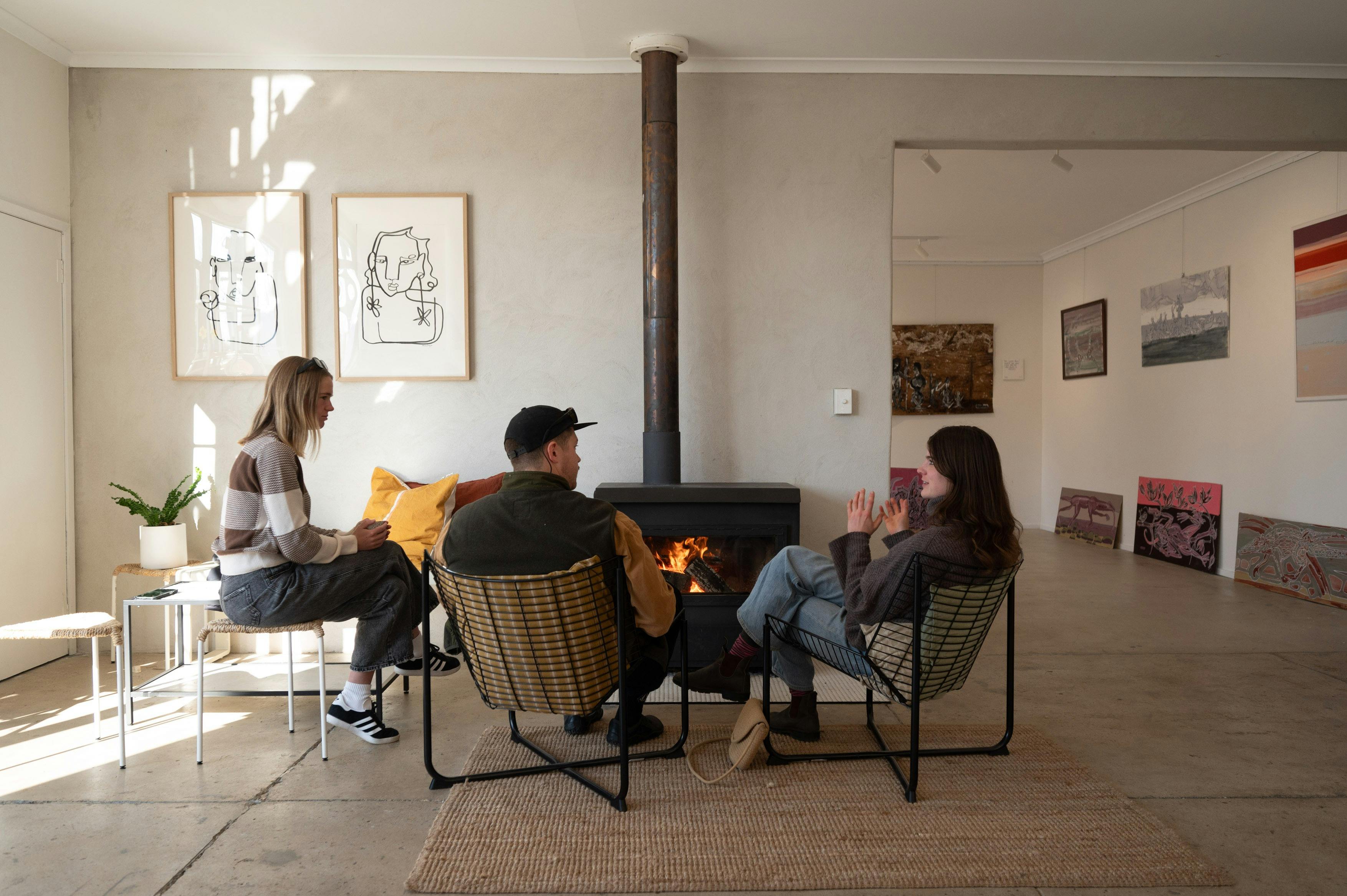 Friends sipping by the fire