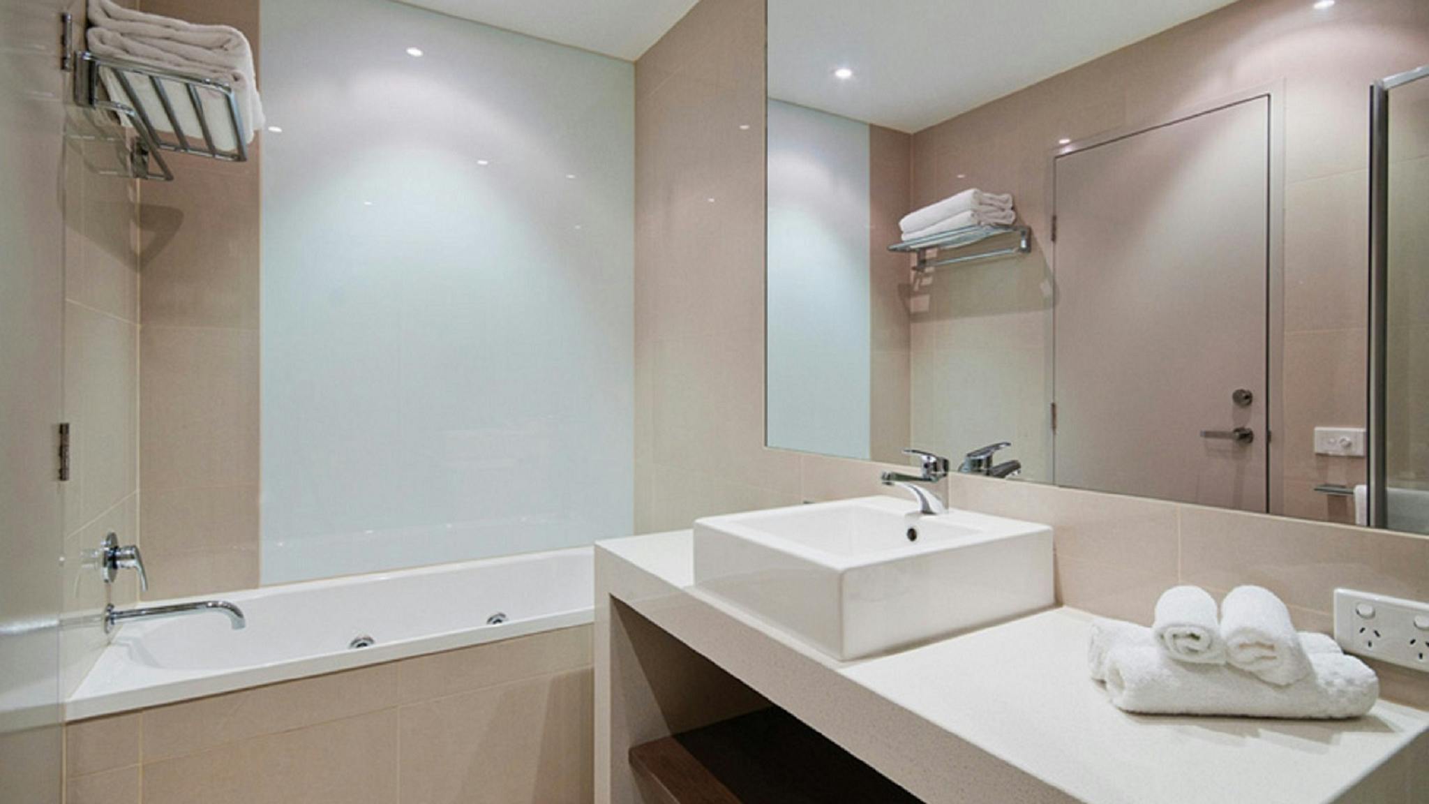 The Gateway's Apartments include bathroom with spa bath and separate toilet