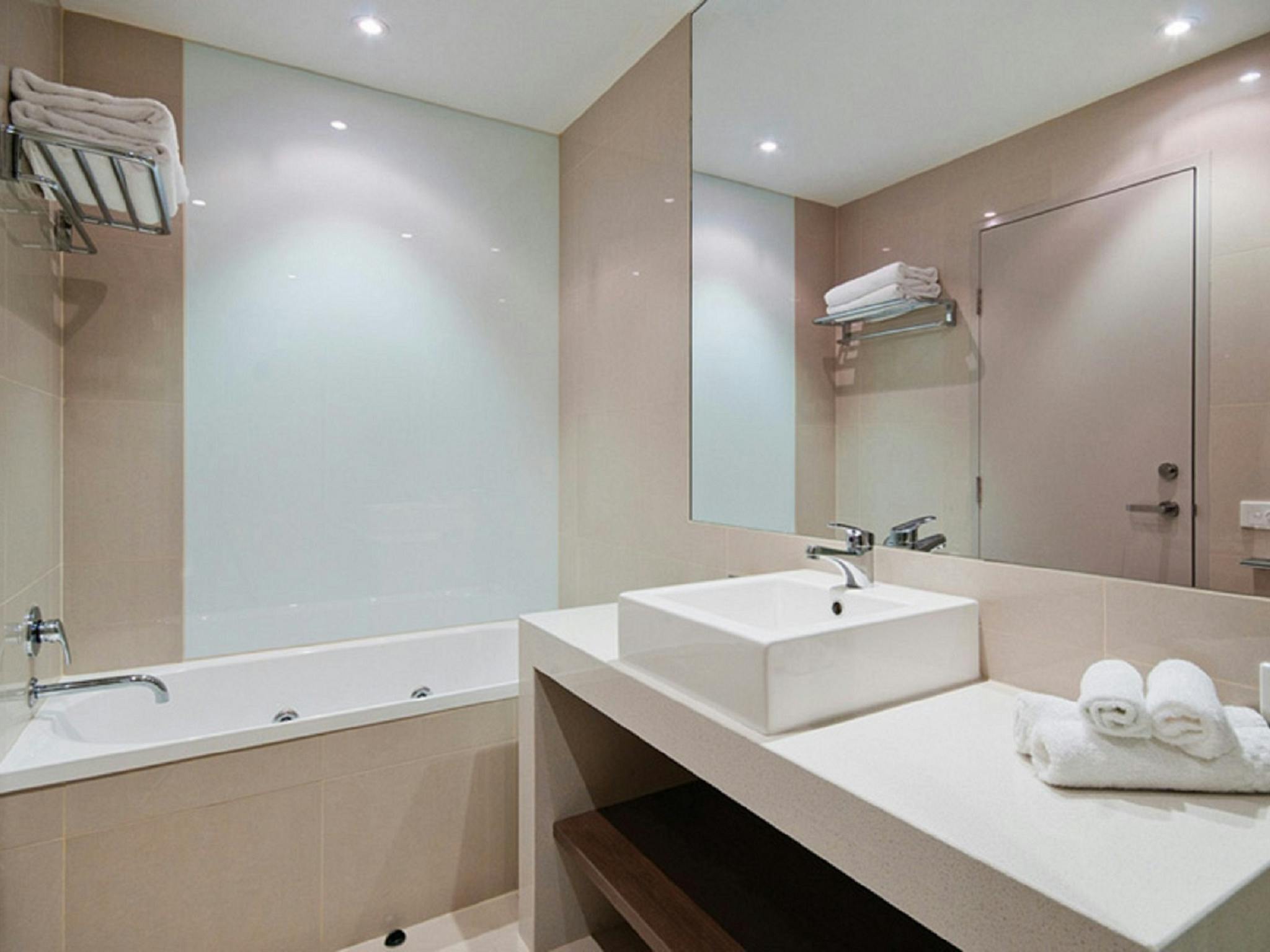 The Gateway's Apartments include bathroom with spa bath and separate toilet