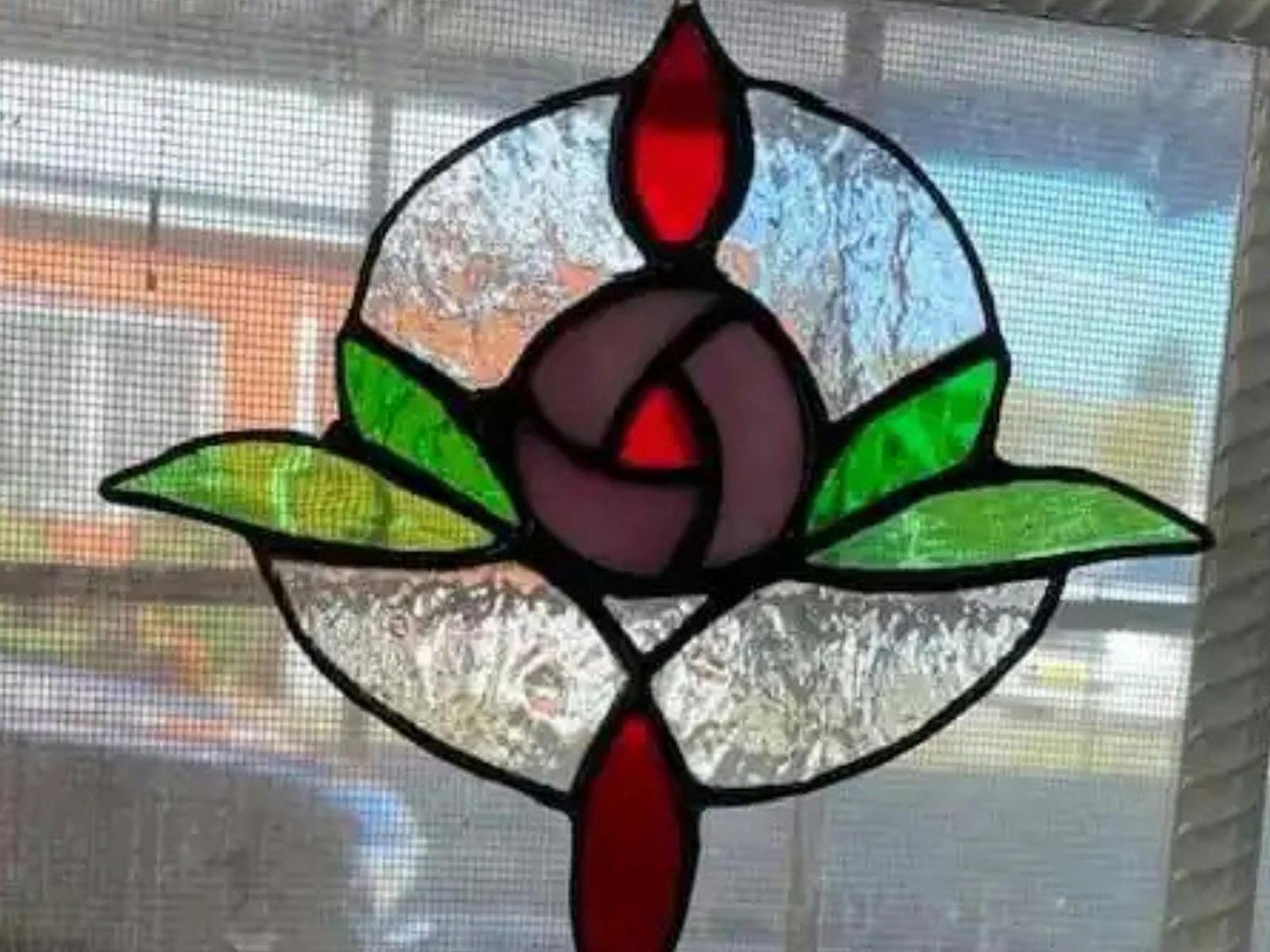Stained glass ornament hanging in window
