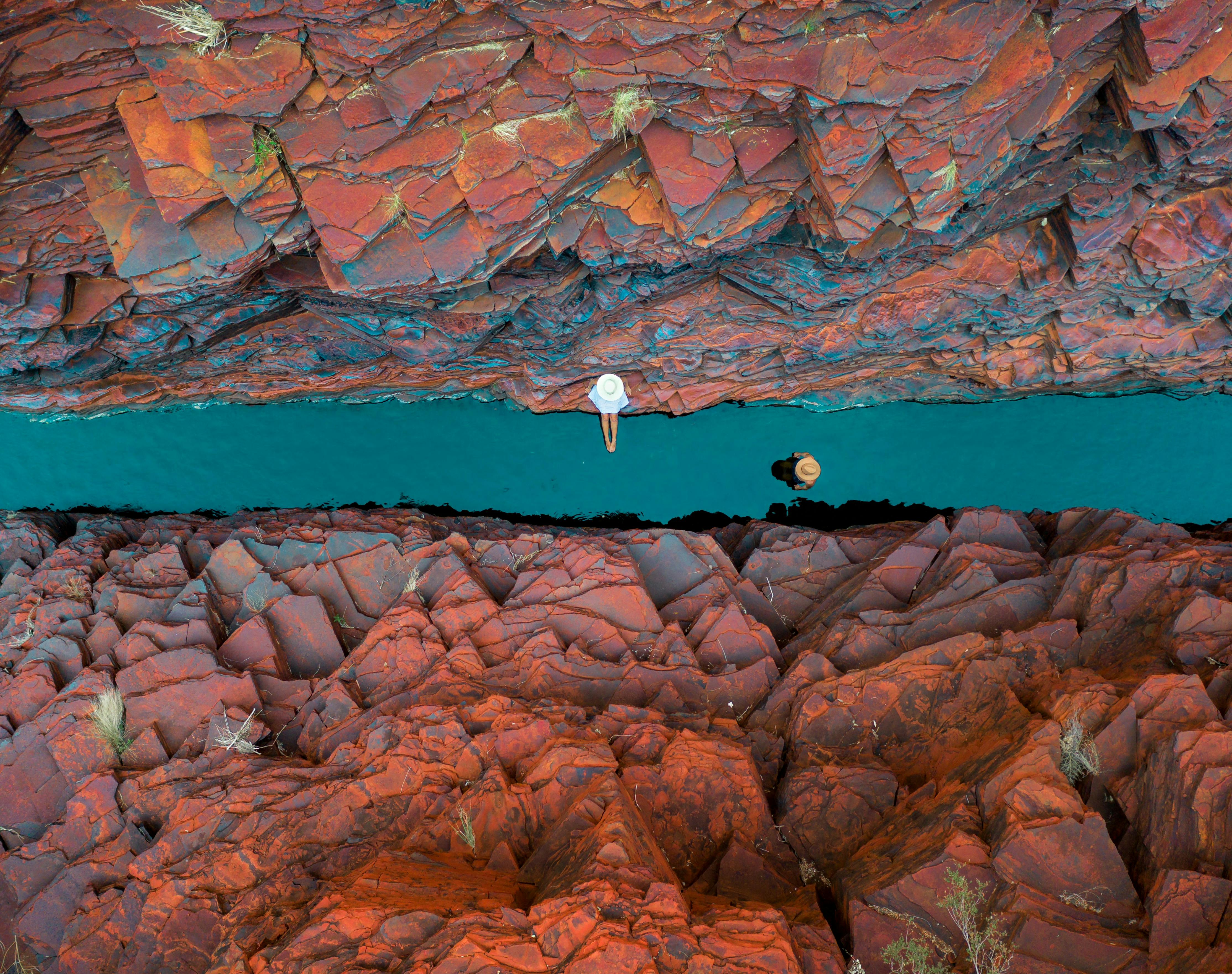Overhead view of people swimming in Weano Gorge Pool inside Karijini National Park