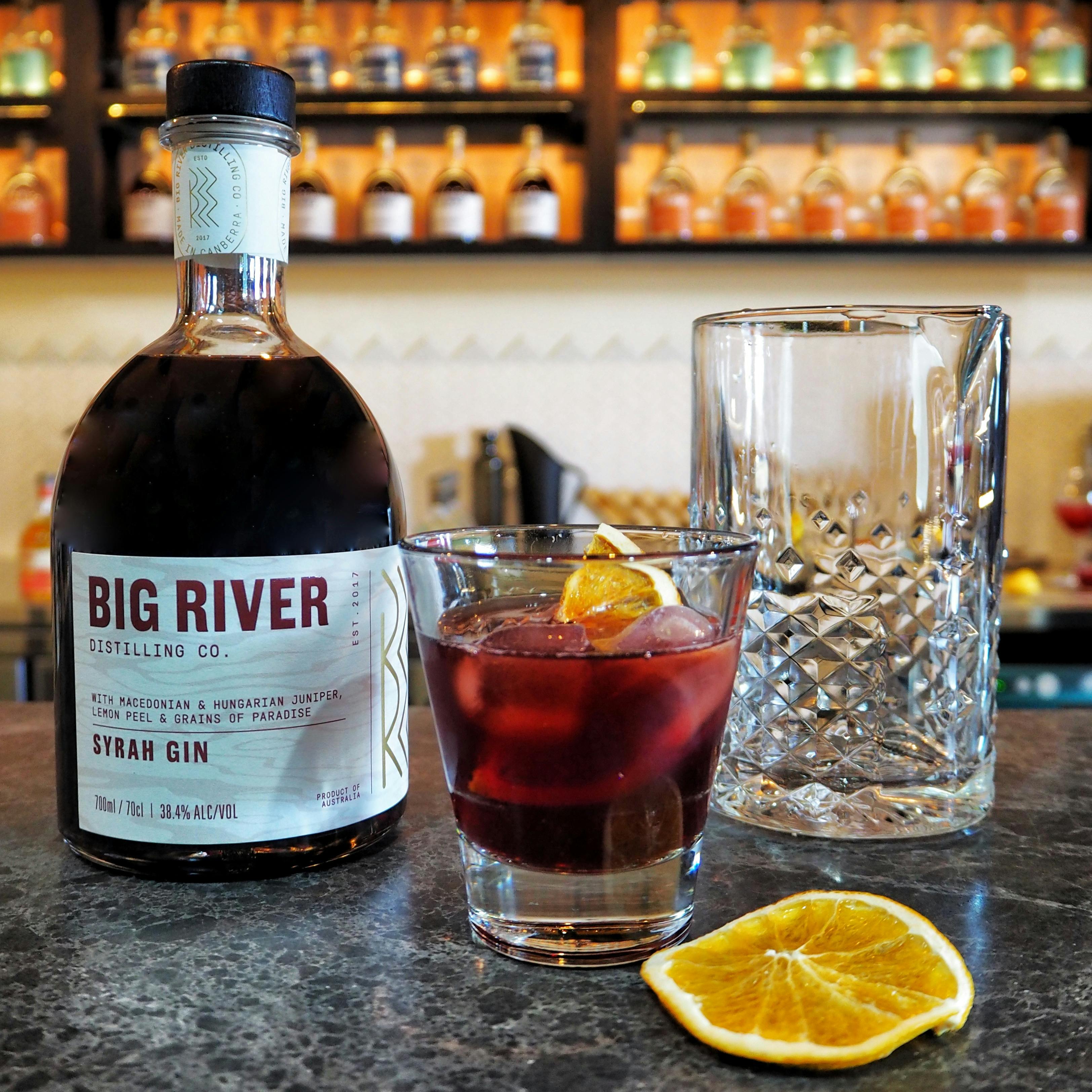 Syrah Gin bottle and negroni cocktail