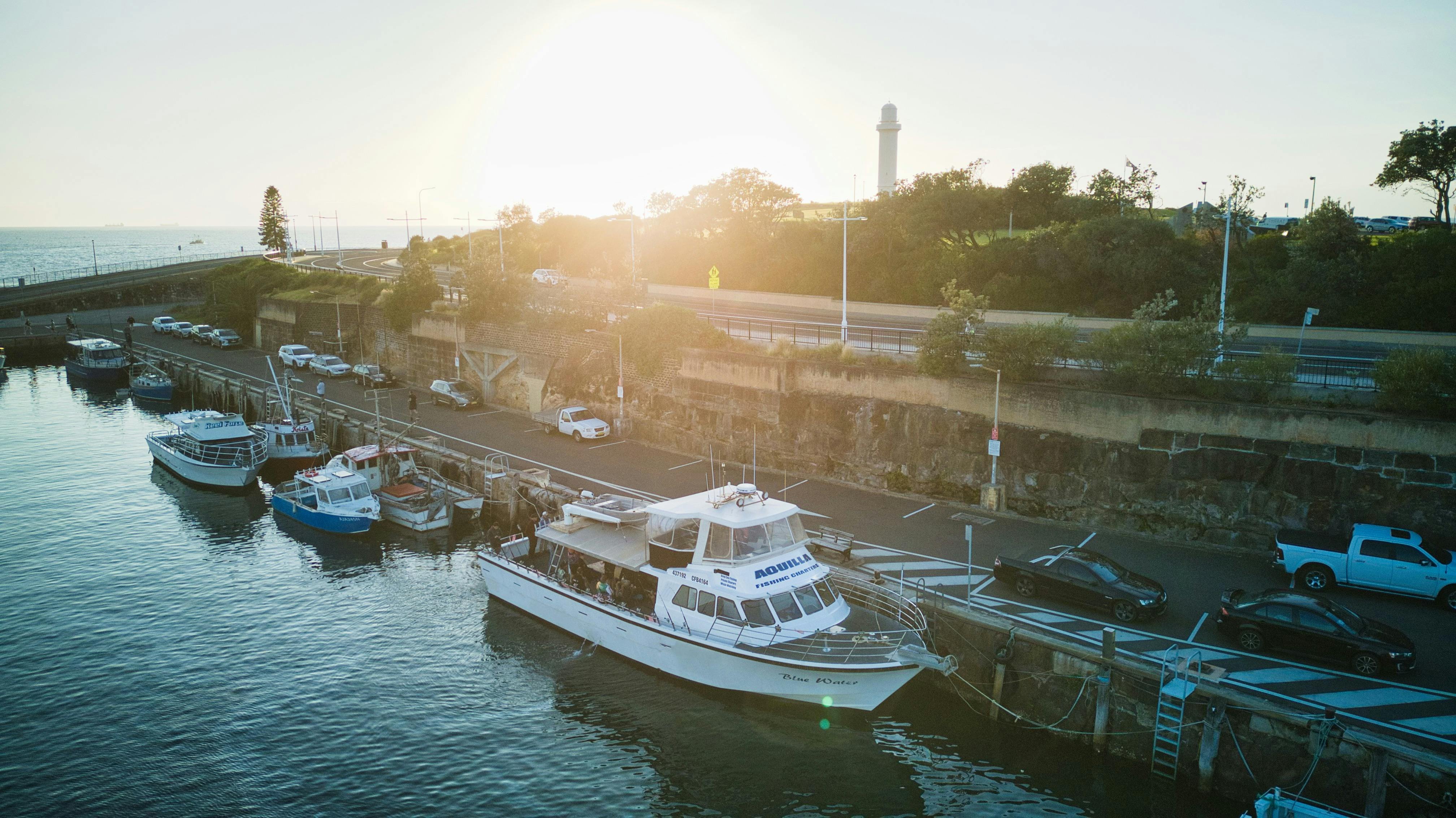 Wide shot of vessel against a sunrise background