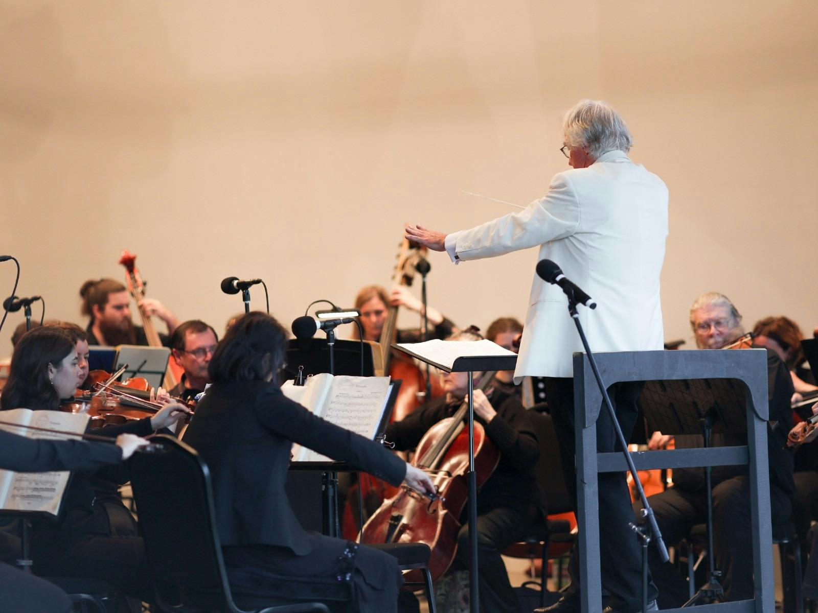 The Lake Macquarie Philharmonic Orchestra performing on stage