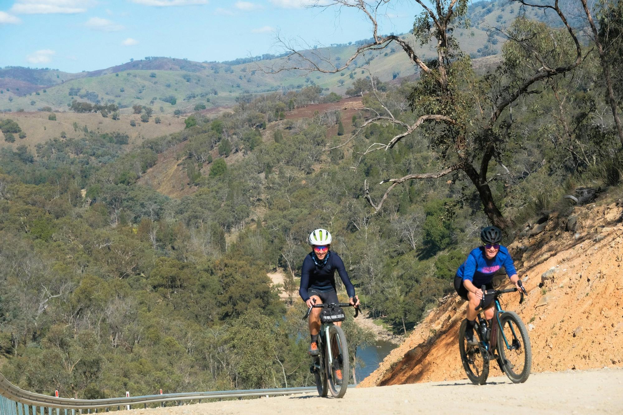 two cyclists ride up a difficult section of the Bridle Track