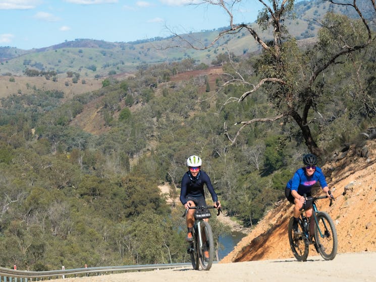 two cyclists ride up a difficult section of the Bridle Track