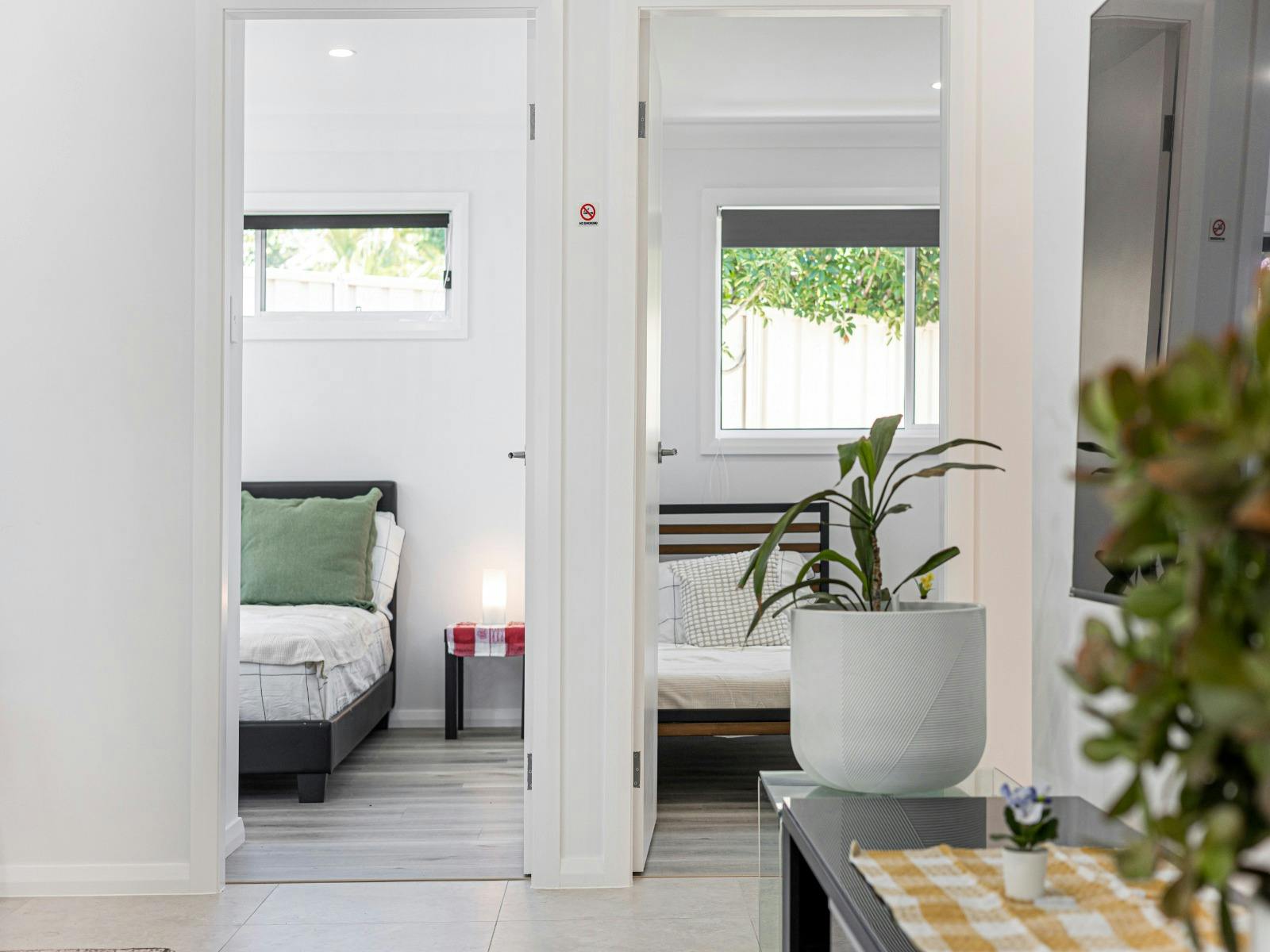 Light-filled bedroom featuring a comfortable bed and peaceful ambiance.