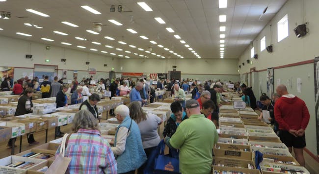 Depicts a view of the  Hall at a Book Fair,