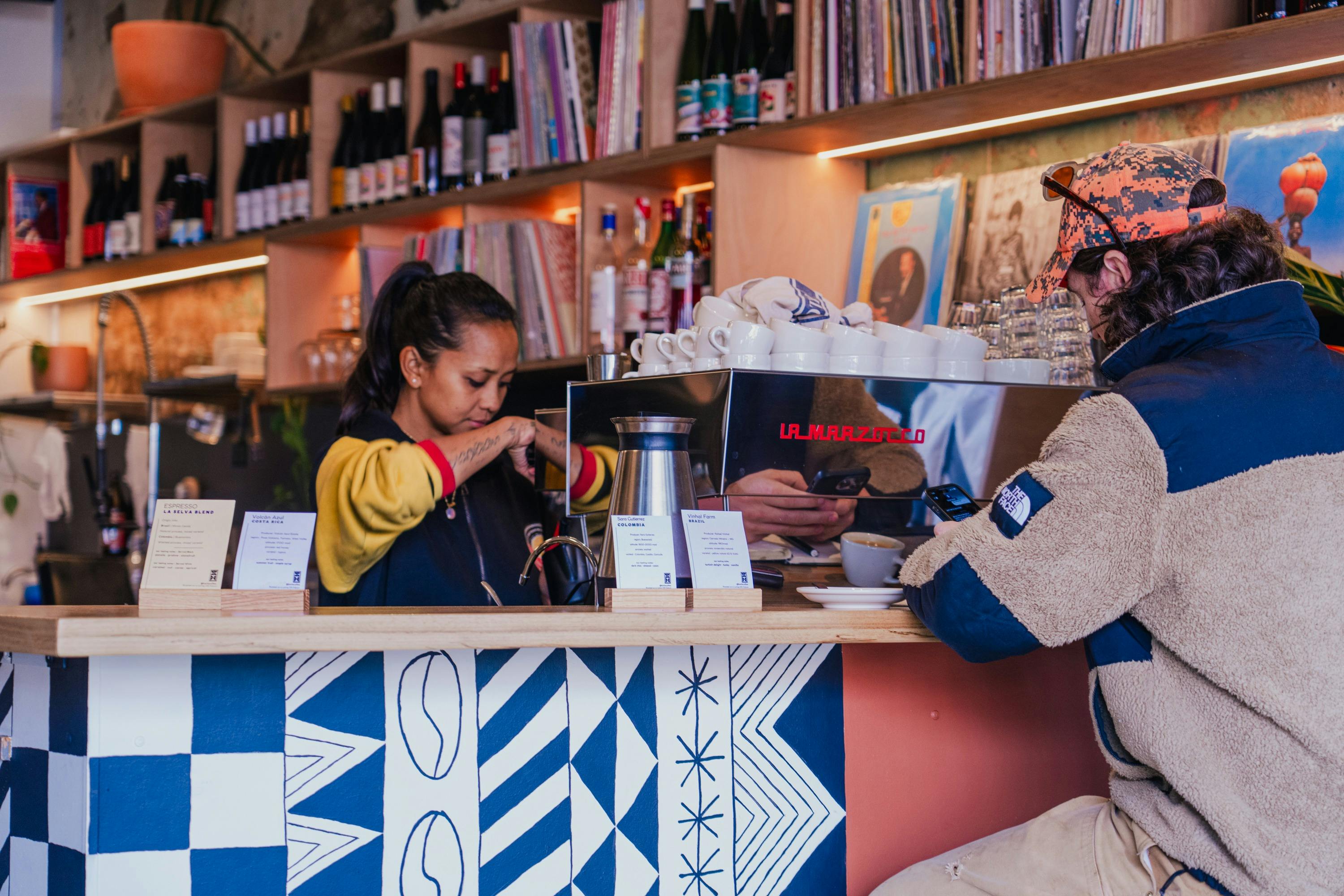 Barista serving coffee