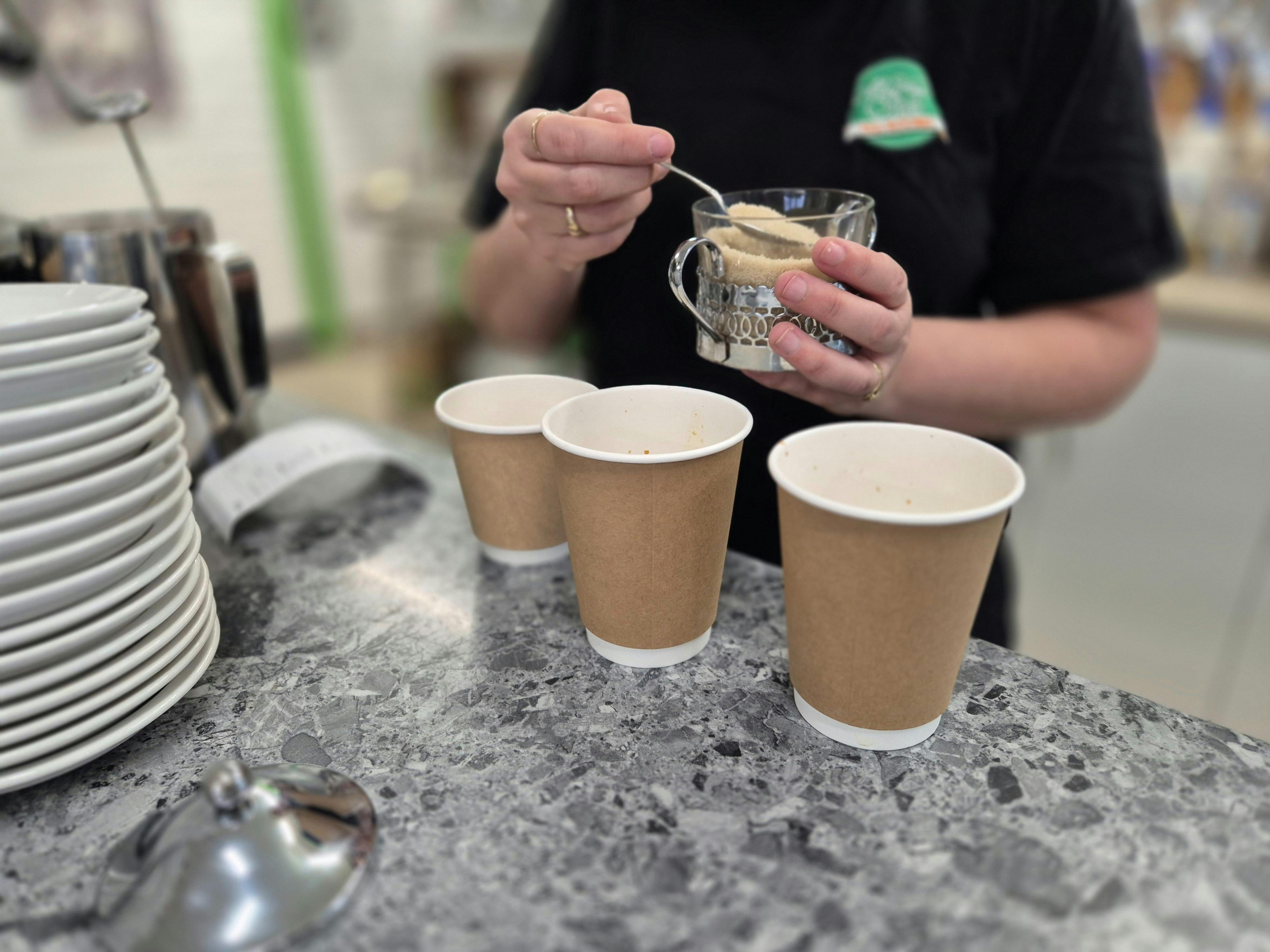Supported volunteer preparing a takeaway order