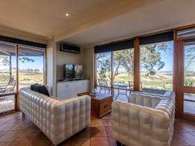 Lounge with spectacular views across the valley below