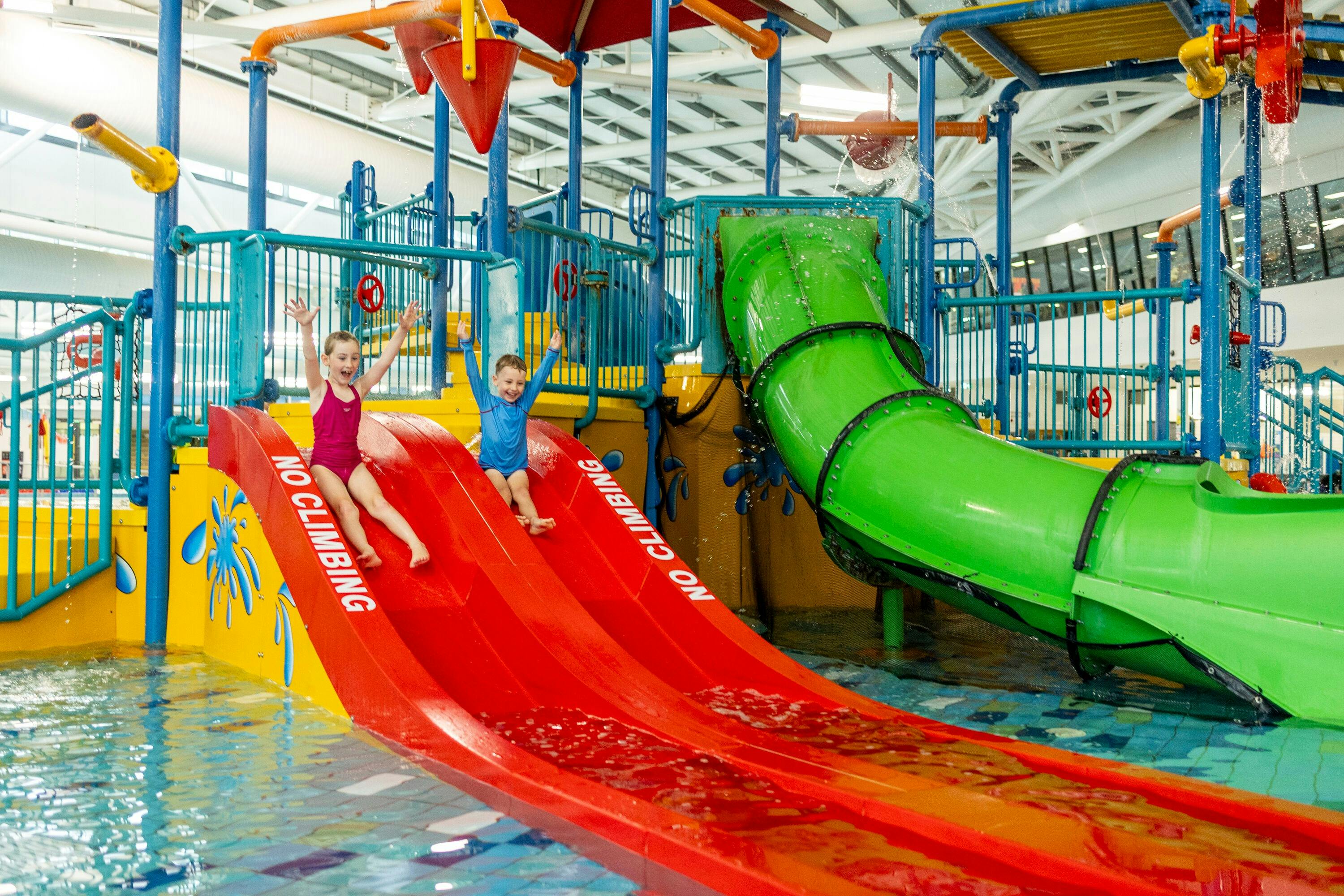 Kids going down water slide