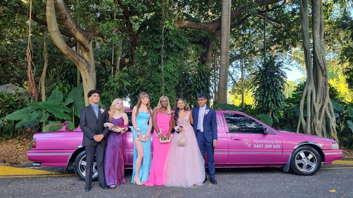Making a colourful statement, Year 12 students pose with the iconic 'Pink Lady' Ford LTD Limousine