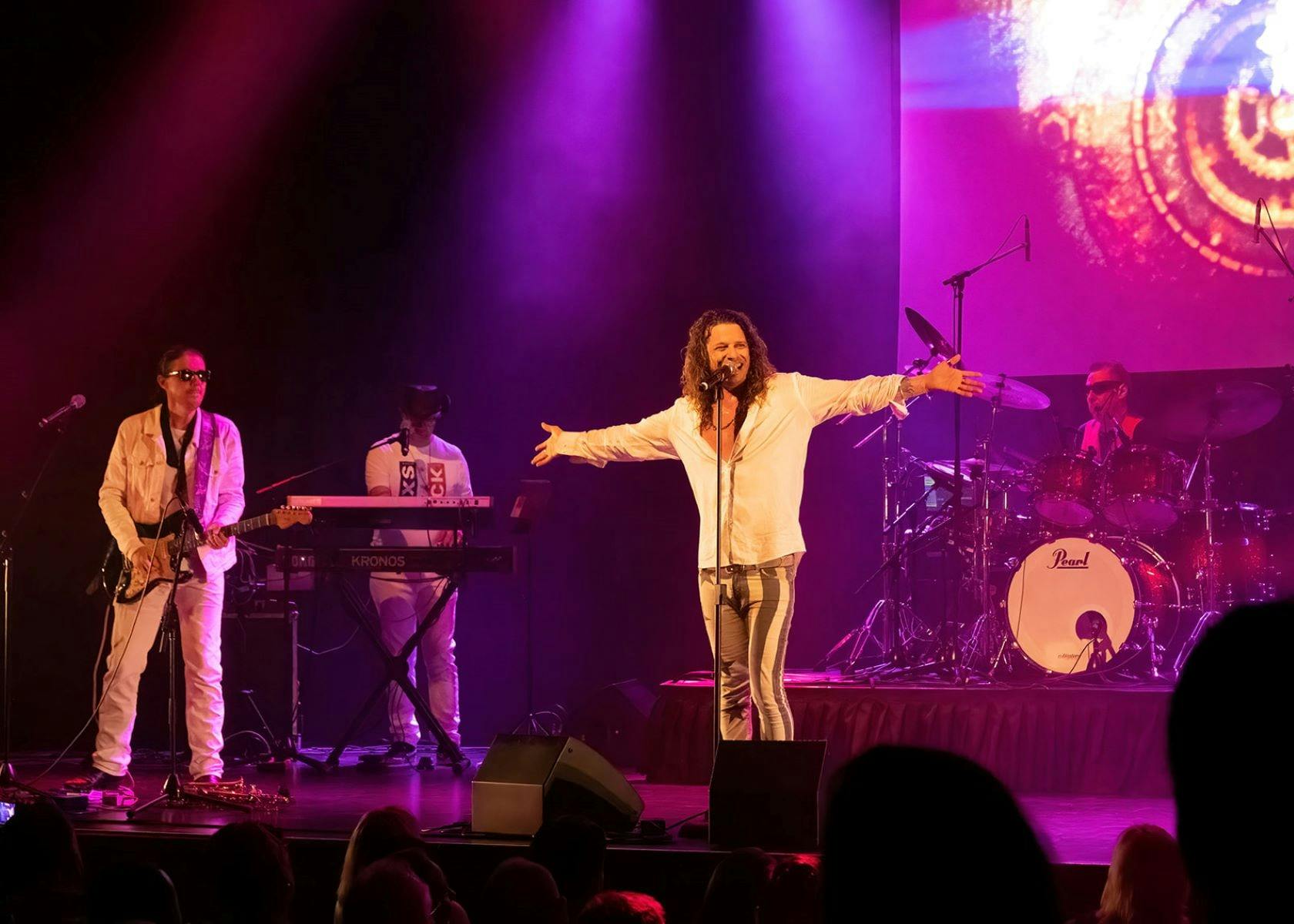 Dellacoma Rio as Michael Hutchence performing on stage