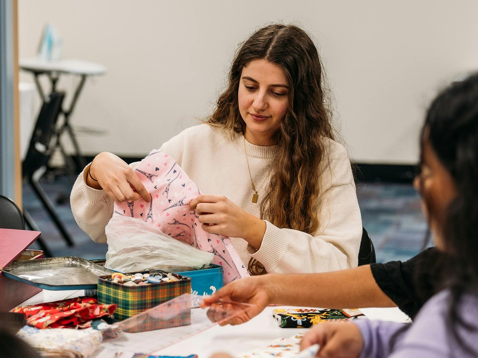 Person using textiles to create art