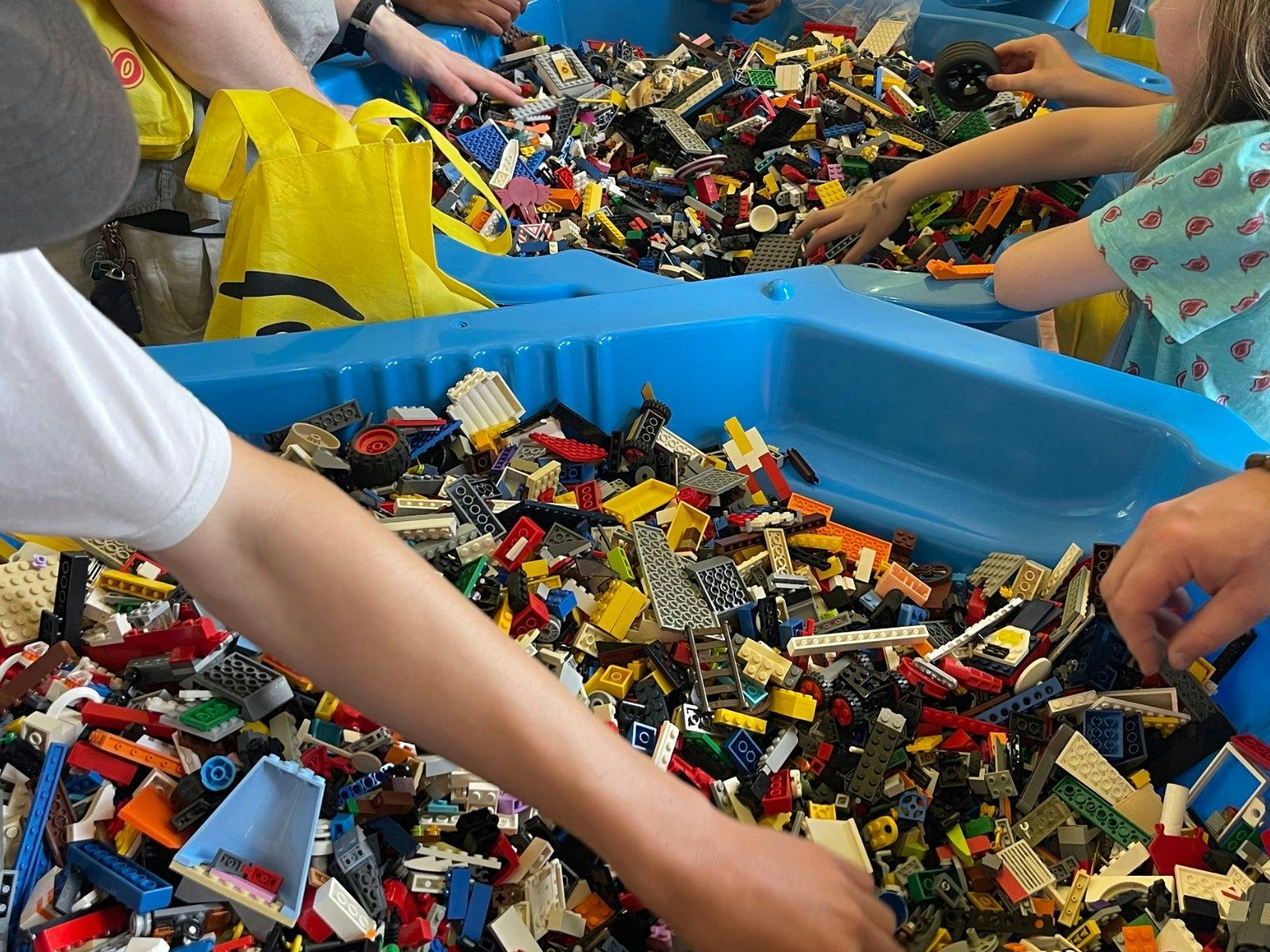 Large shells of lego with hands going in