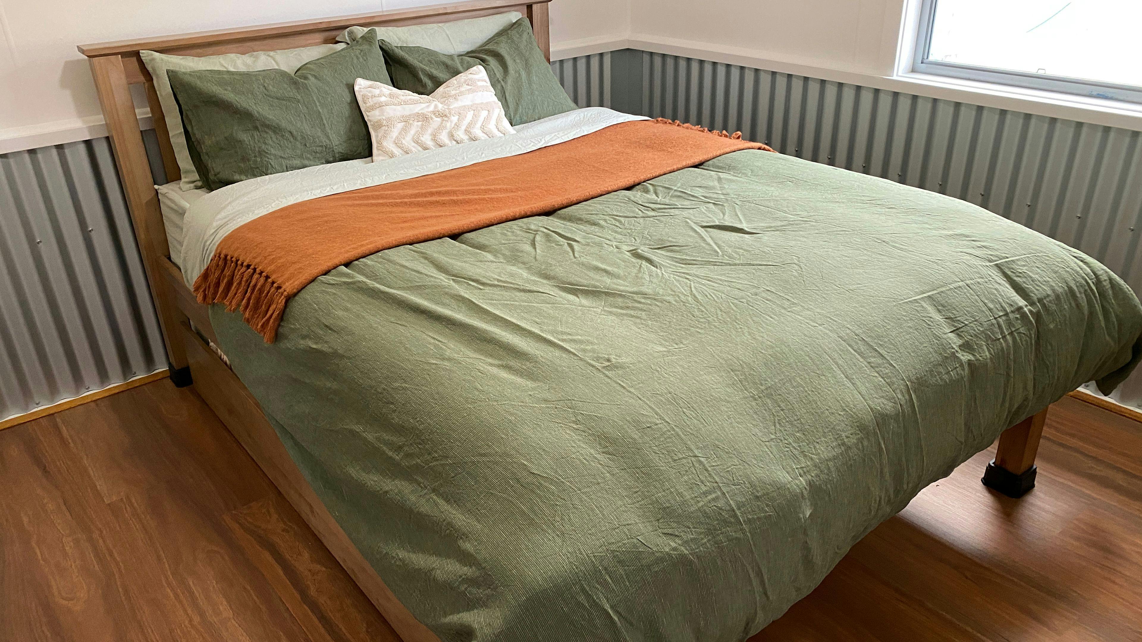 Queen bed with single trundle bed that wheels out.