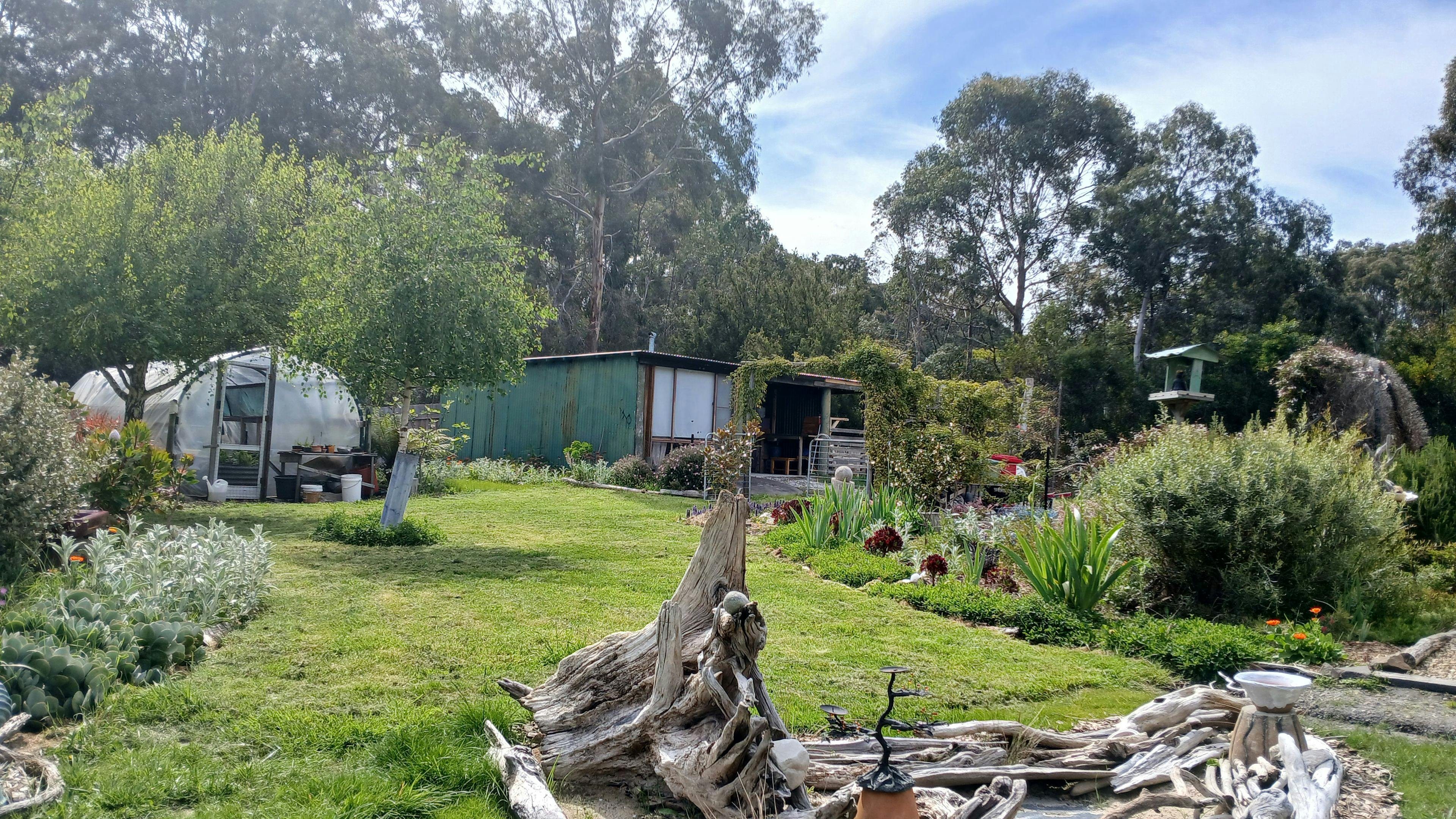 The 'cabin' is a double garage/shed that has been converted into comfortable off-grid living quarters. Prettier on the inside than out!