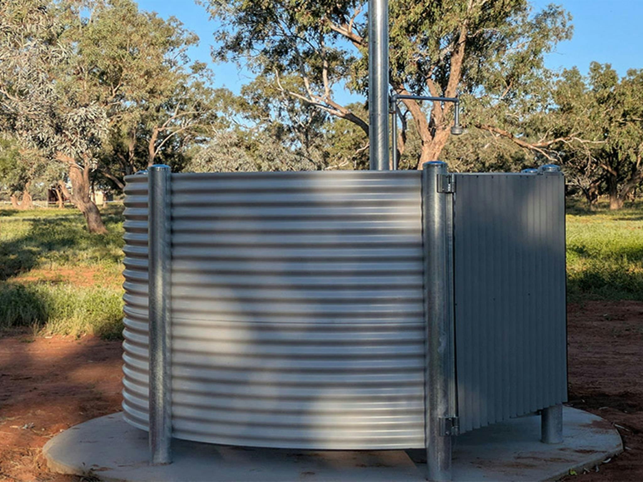 The open air artesian shower at Comeroo campground. Credit: Jessica Stokes &copy; DCCEEW