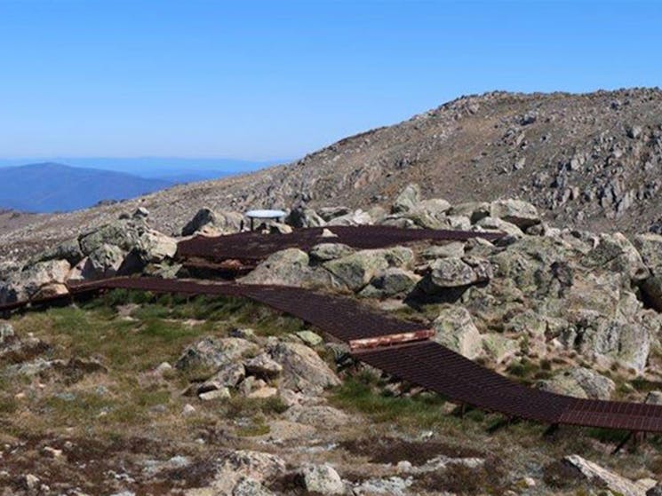 The winding metal mesh path to Cootapatamba lookout in Kosciuszko National Park. Photo: Luke