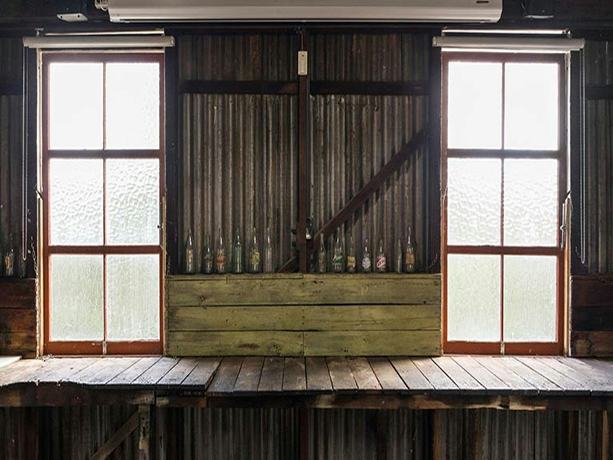 A row of bottles inside Corney's Garage in Hartley HIstoric Site. Photo: Jennifer Leahy &copy; DPIE